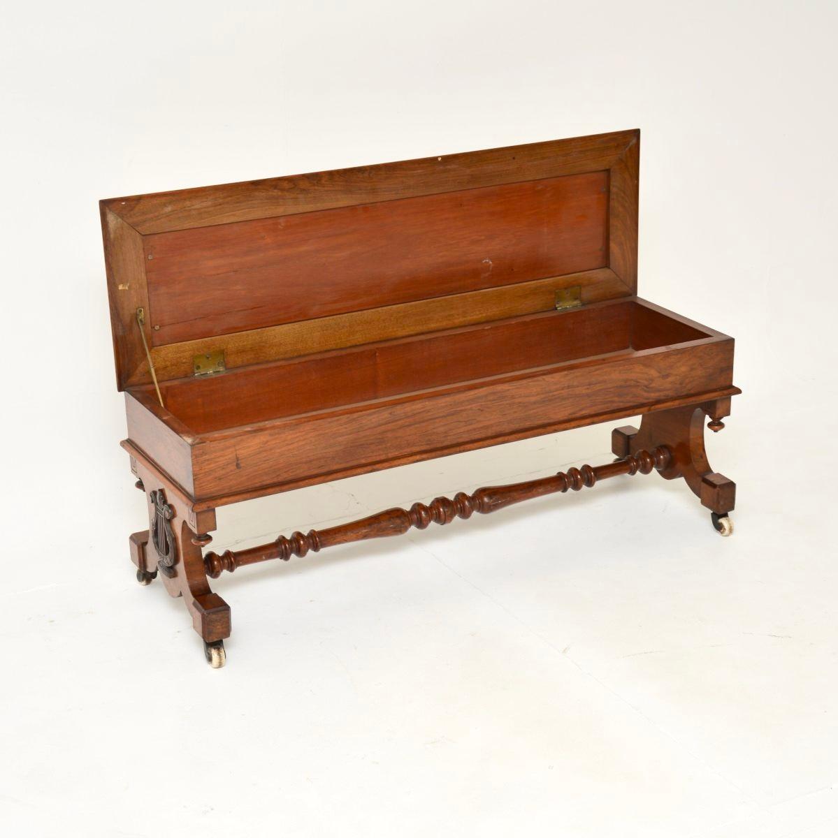 A beautiful and very well made antique Victorian walnut piano duet stool / bench. This was made in England, it dates from the 1840-60 period.

The quality is excellent this has a lovely and very useful design. Designed for duets at a piano, this is