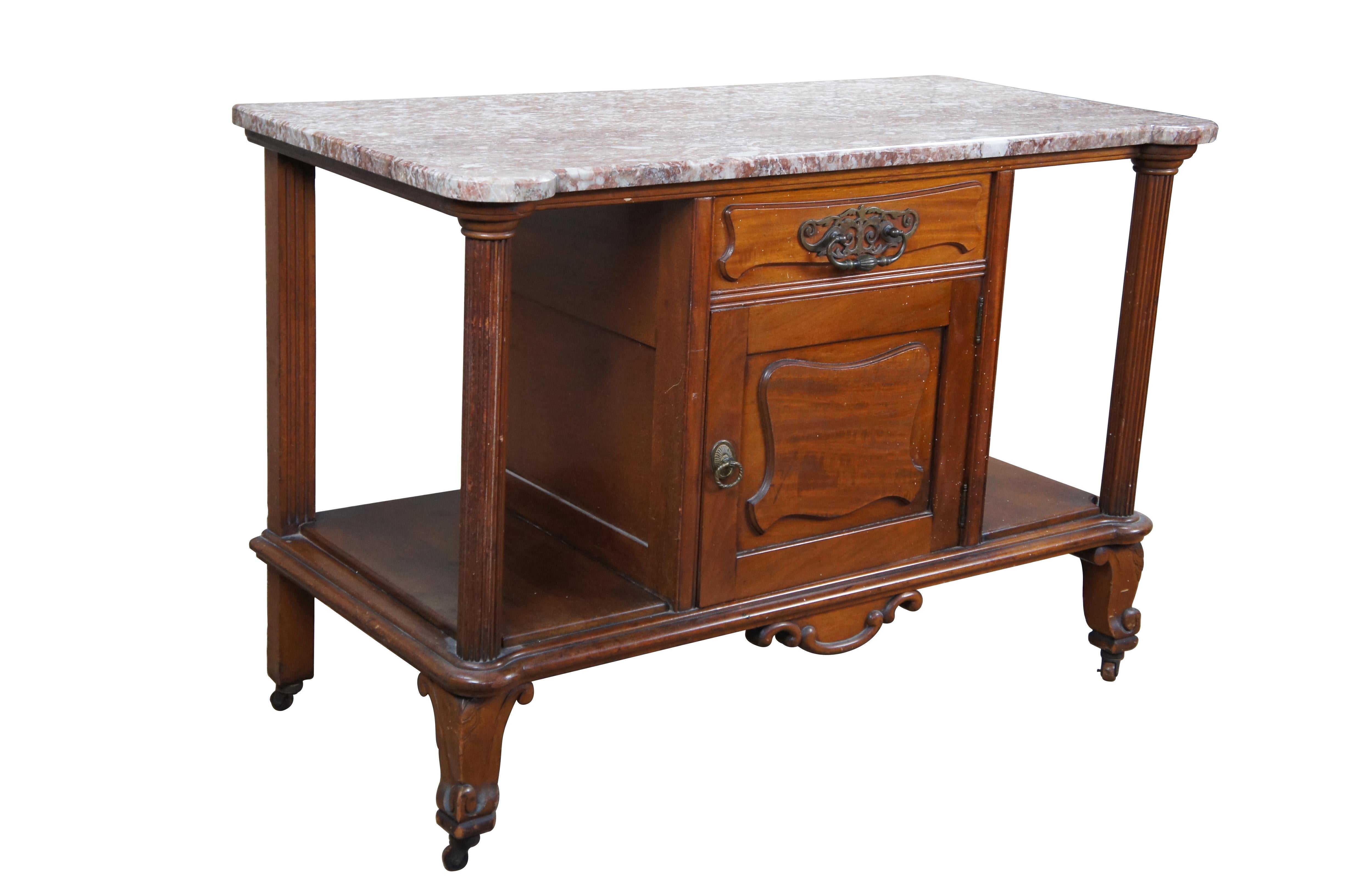 Antique Victorian marble top wash stand / server / console / buffet / sideboard / entry table.  Made of walnut featuring upper drawer and lower cabinet with rouge marble top supported by reeded columns and cabriole style legs with