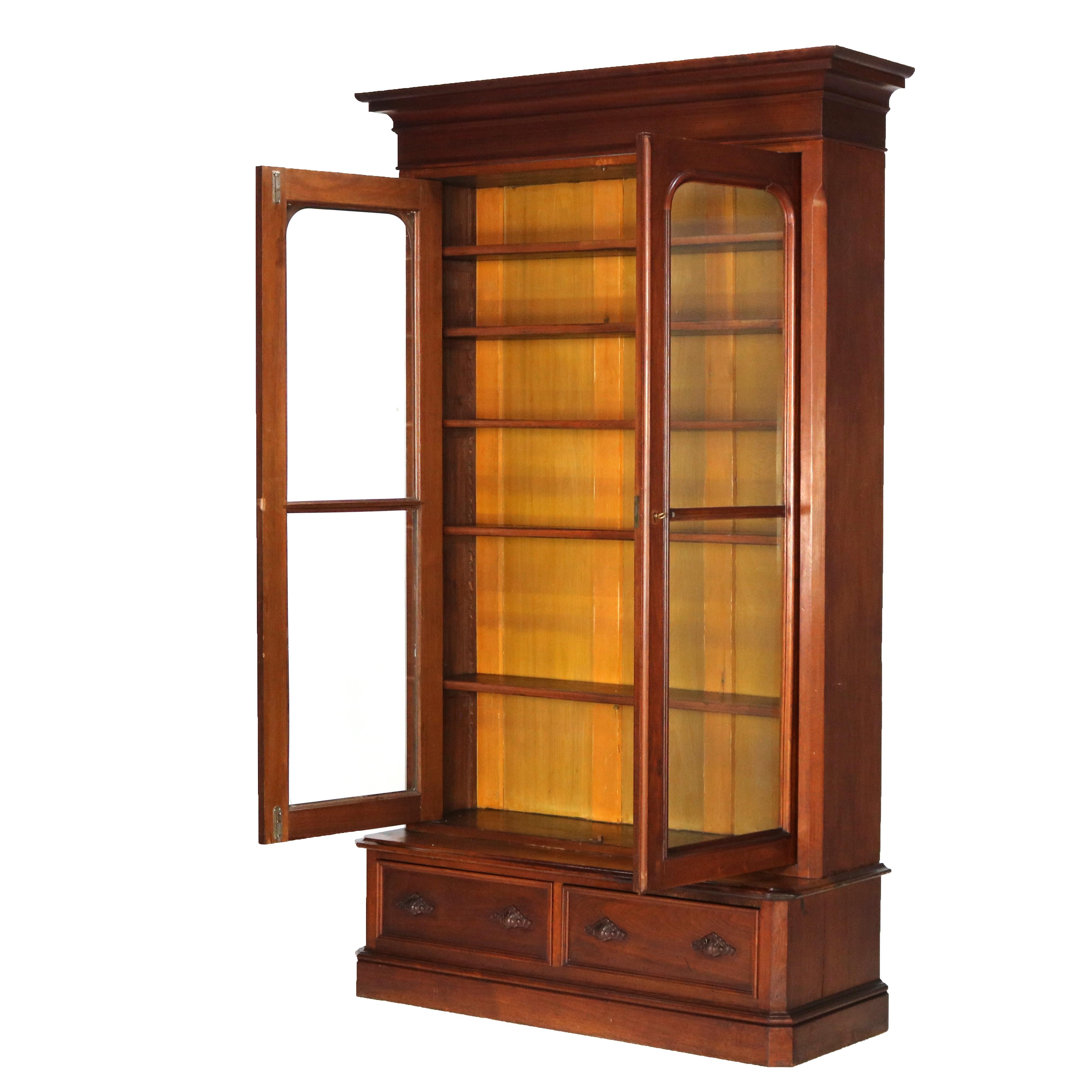 ***Reduced In-House Delivery Rates - Click on “Ask Seller” to Request a Quote***

Antique Victorian Walnut Two Door Two Drawer Step Back Bookcase C1890.   

Measures - 89.25