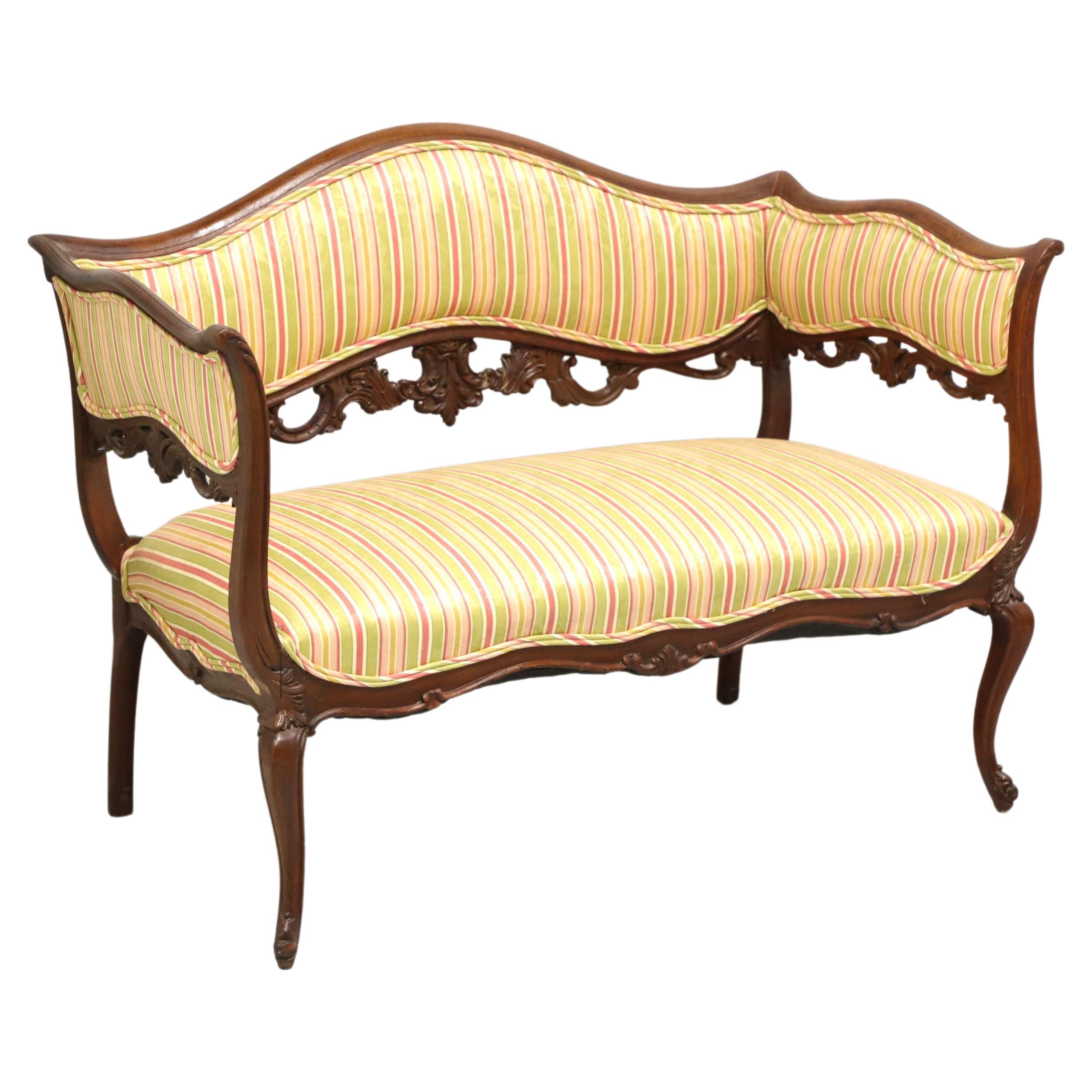 Antique French Carved Walnut Settee in Vintage Fortuny Fabric at 1stDibs