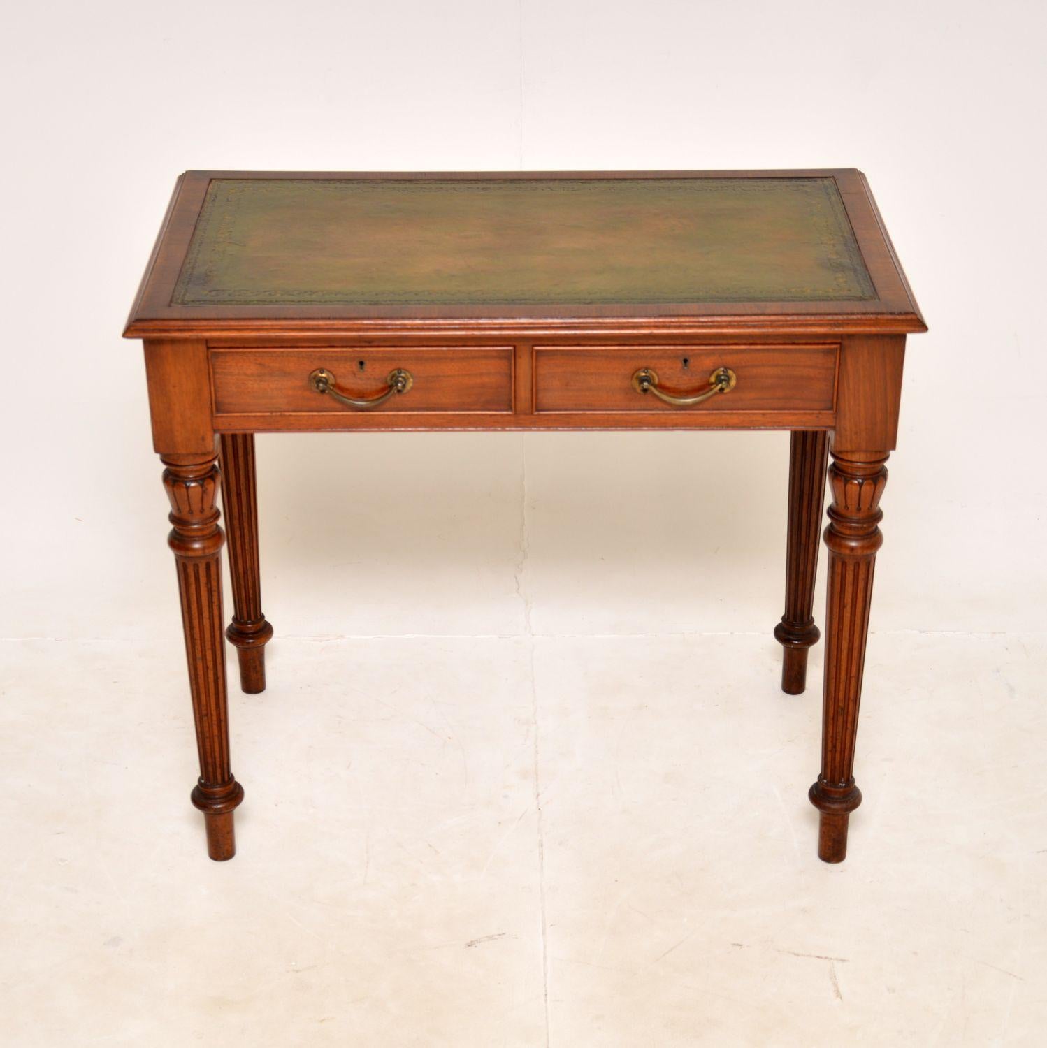 A superb antique Victorian writing desk in solid walnut. This was made in England, it dates from around the 1860-1880 period.

It is of amazing quality and is a very useful size. The legs are beautifully turned with wonderful carved details. The