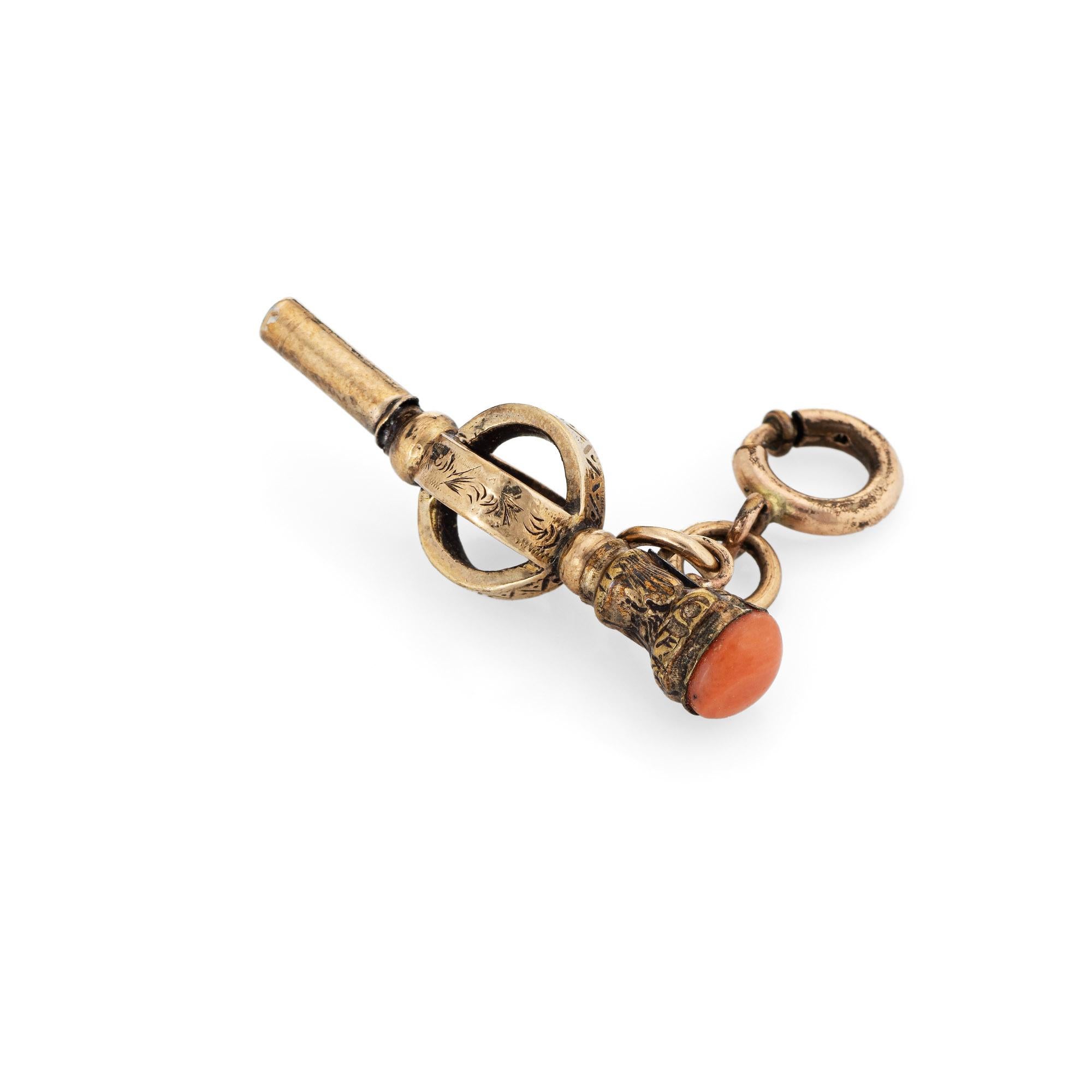 Finely detailed antique Victorian watch key fob crafted in 9k yellow gold.  

Natural coral measures 5mm (in good condition and free of cracks or chips). 

The decorative watch fob features ornate etched foliate detail. With a chain link available