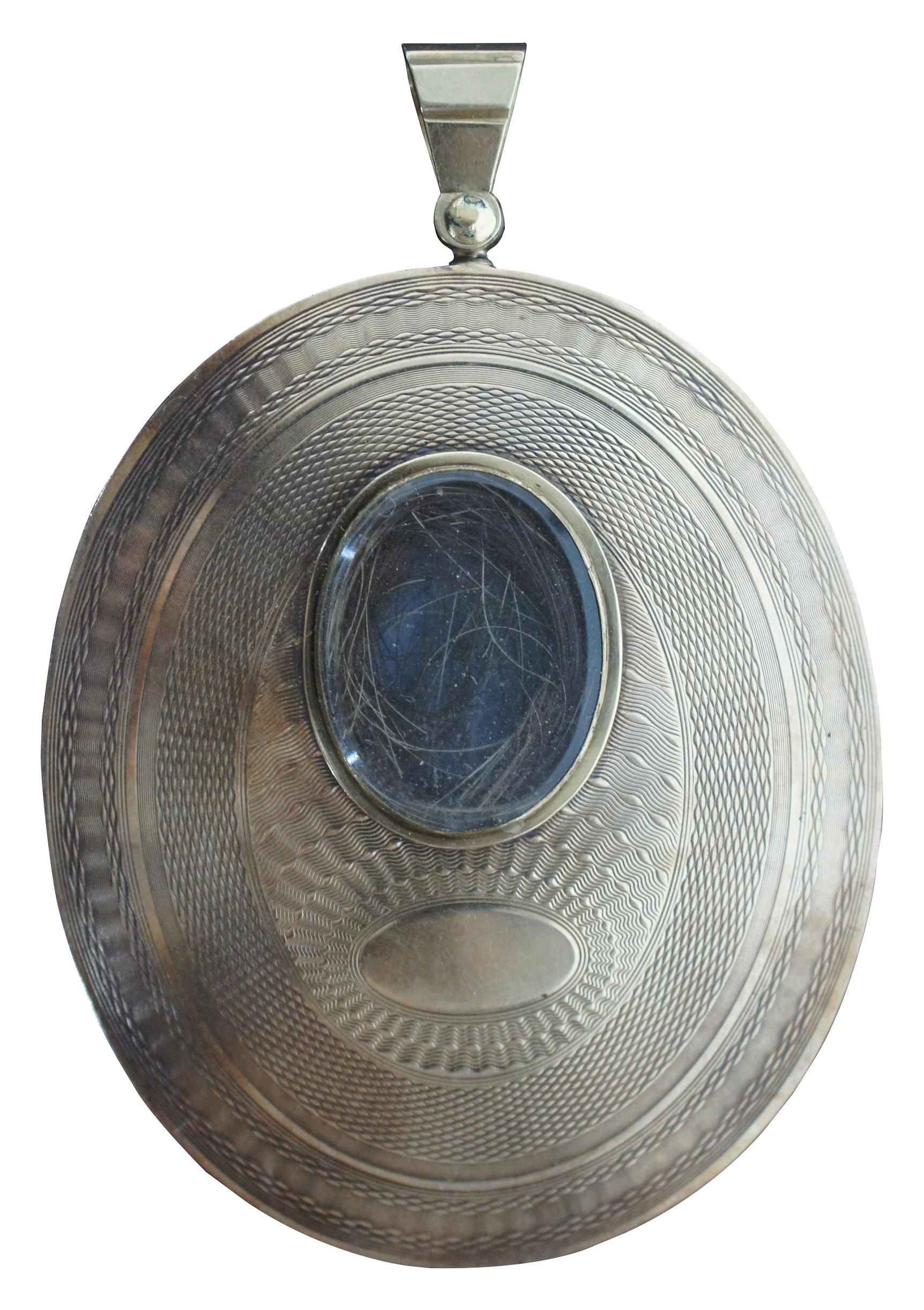 Expertly painted antique Victorian watercolor portrait of a man set in a large gold tone locket with an extra compartment containing a lock of hair.

Measures: 2” x 0.125” x 3” / Sans Frame - 1.875” x 2.25” (Width x Depth x Height).