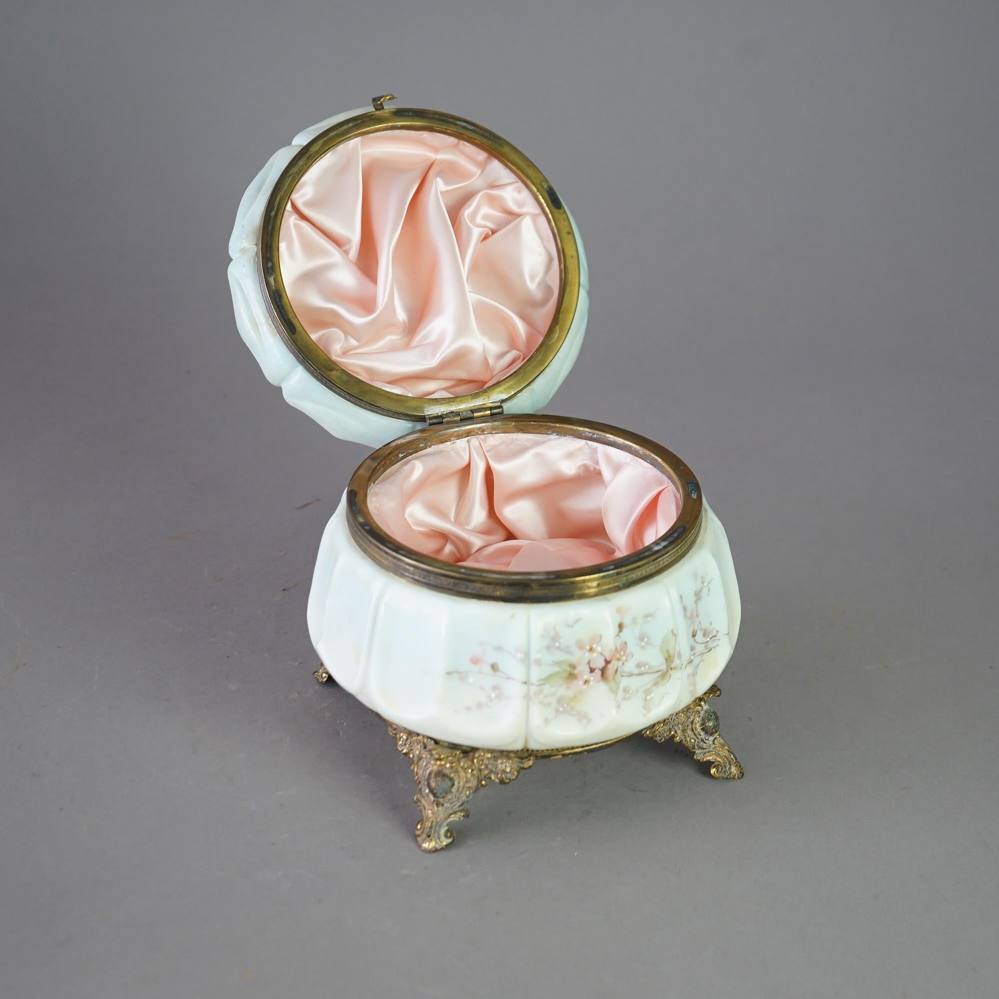An antique Victorian collar dresser box by Wave Crest offers glass box having enameled floral decoration, hinged lid opening to satin lined interior and raised on foliate cast footed base, c1890

Measures- 7''H x 7.75''W x 7.75''D