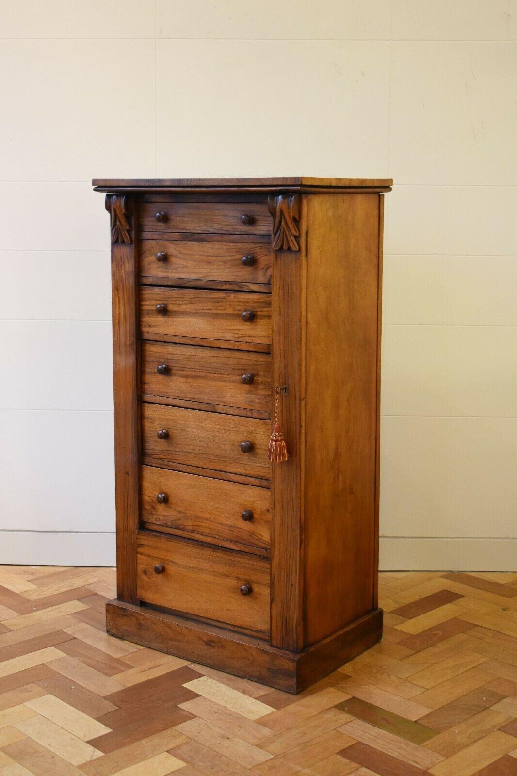 A superb Victorian Wellington Rosewood Chest c.1890's

This rare and unique piece boasts a bank of seven graduated drawers that are enclosed behind a lockable side panel, that can be opened with its original and beautiful key. 

The wood features a