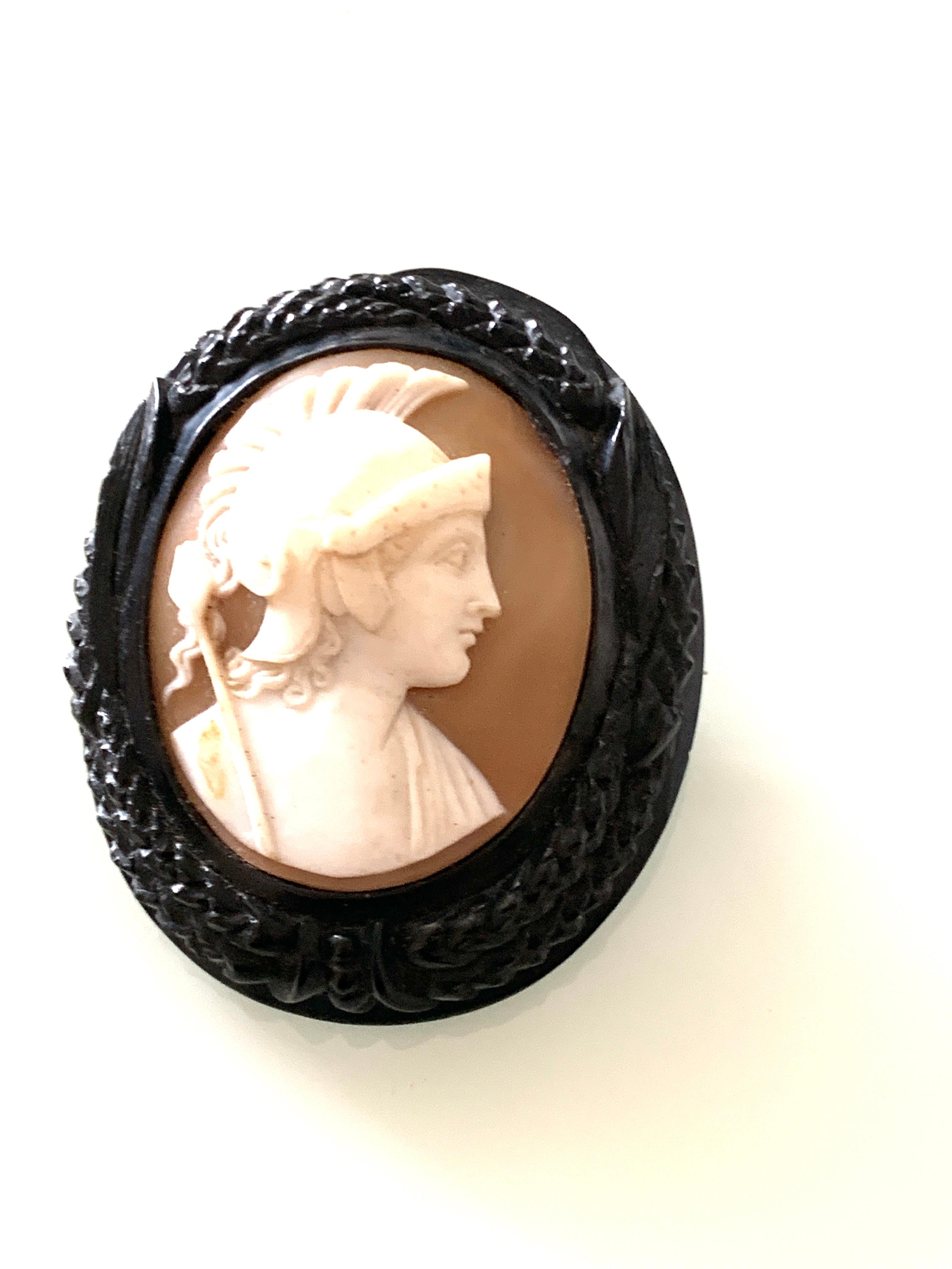 Very Large
Antique Victorian Mourning brooch
made from Black Whitby Jet and Cameo Shell 
depicting a soldier
Pin is secure
edging is in very good condition
( no damage )
Size 5cm x 4 cm 
Weighs 23.78 grams
