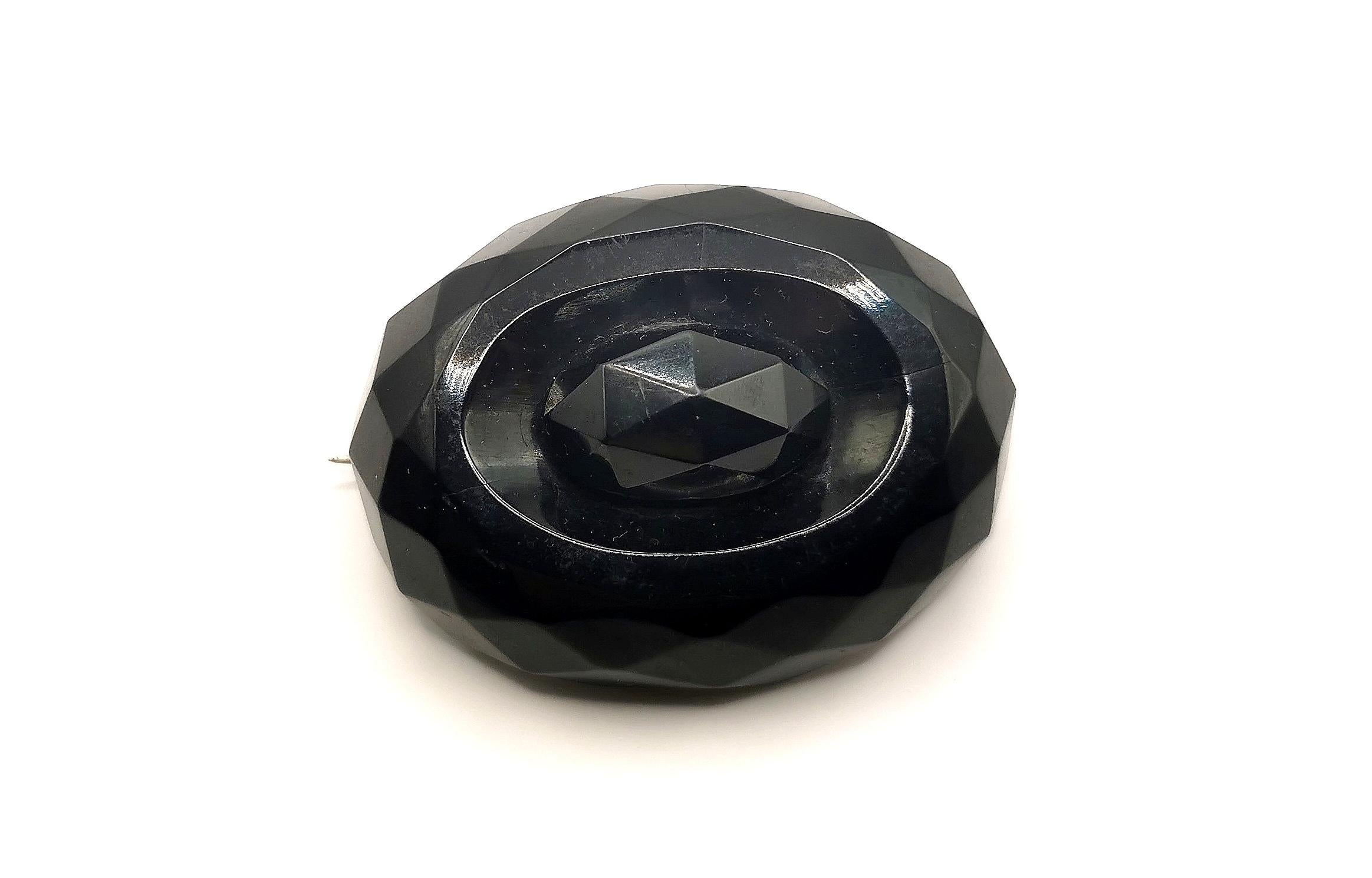 A gorgeous antique Victorian era Whitby Jet brooch.

It is an oval shaped brooch with a faceted design, the facets reflect the light beautifully.

A very attractive brooch.

Whitby Jet shot to popularity in the Victorian era as a material used in