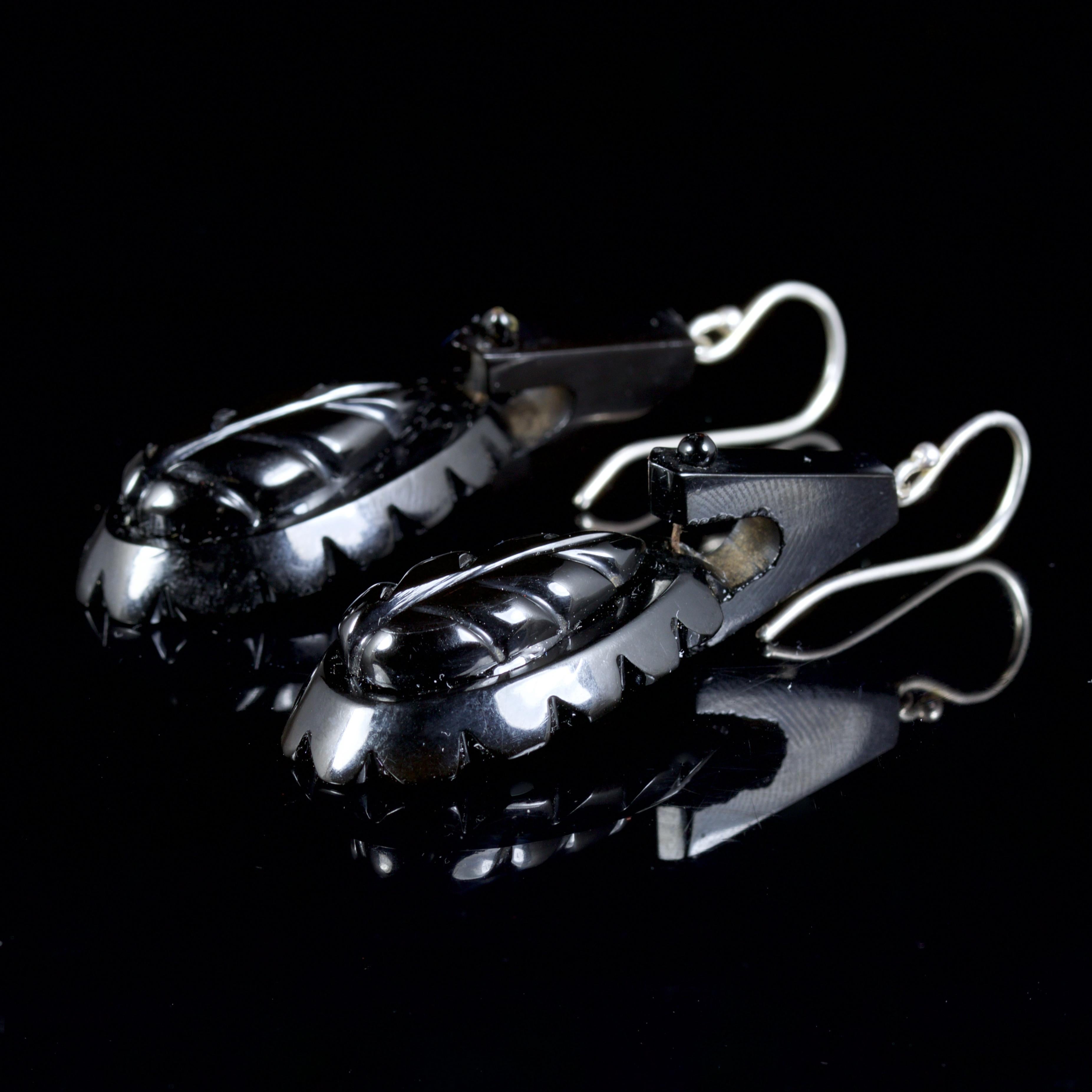 These lovely long Whitby Jet hand carved earrings are Circa 1860.

Whitby Jet was brought to the attention of the world by Queen Victorian who used Whitby Jet as part of her mourning attire.

Jet is a type of brown coal a fossilised wood from an