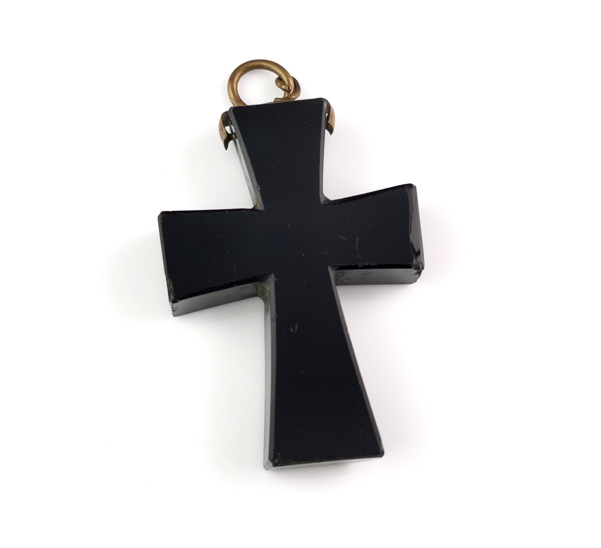 A gorgeous chunky antique Victorian Jet Cross pendant.

It is a shaped Cross made from Whitby Jet and polished to a high shine.

It has a brass swivel bale to the top, looks great hung from a black ribbon or as part of a necklace stack.

It is