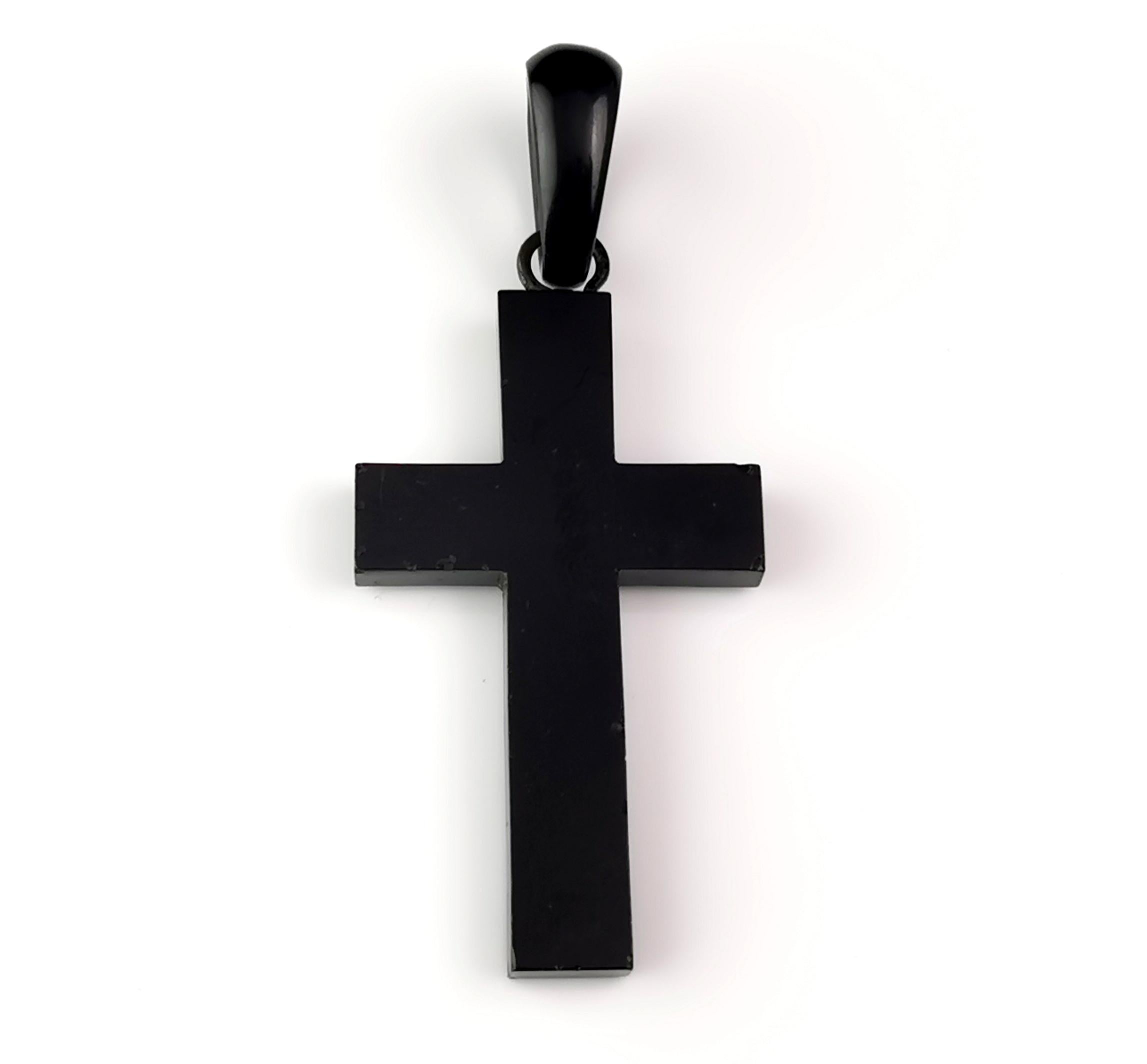 A gorgeous chunky antique Victorian Jet Cross pendant.

It is a shaped Cross made from Whitby Jet and polished to a high shine.

It has a large carved jet bale to the top, looks great hung from a black ribbon or as part of a necklace stack.

It is
