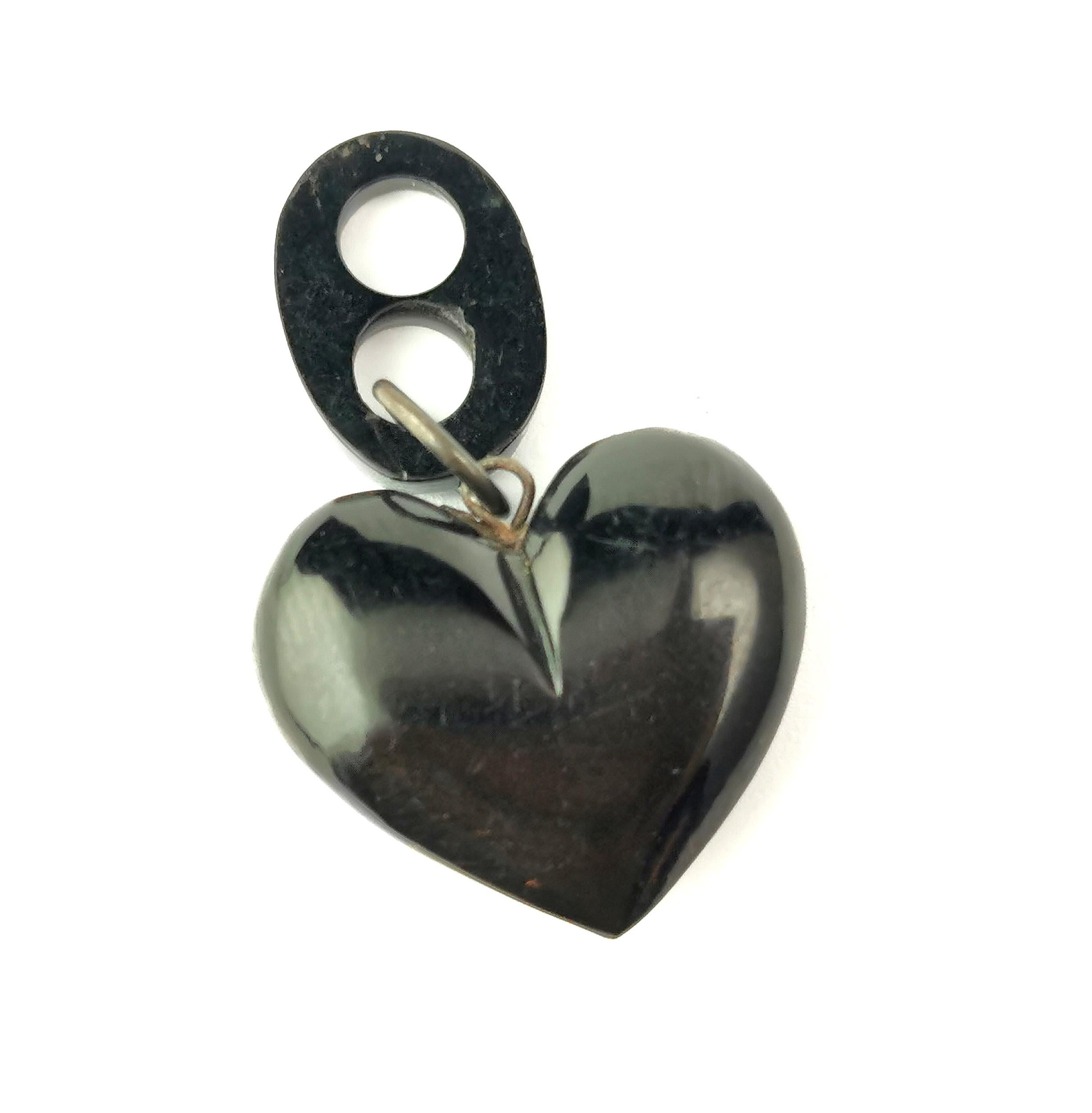 The sweetest little antique puffy heart pendant.

Victorian era it is carved from inky black Whitby Jet with a silver plated jump ring and Jet bale.

Well carved with a lovely chunky shape.

Whilst Whitby Jet was a popular choice for mourning