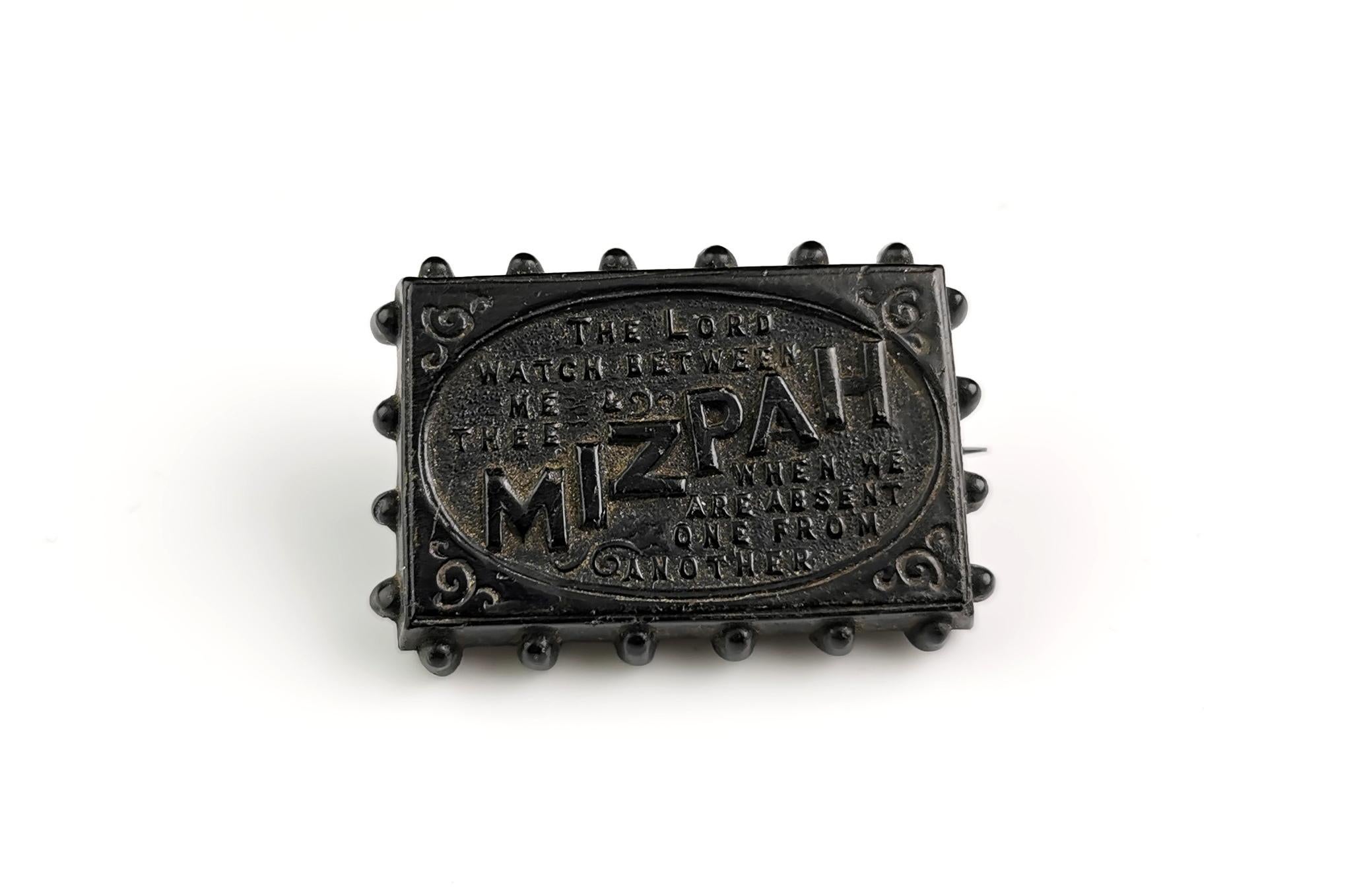 A lovely antique Victorian Whitby Jet Mizpah brooch.

Made from genuine Whitby Jet, it is a rectangular shape with a beaded edge and text to the centre.

Reads Mizpah, the Lord watch between me and thee when we are absent from one another.

A lovely