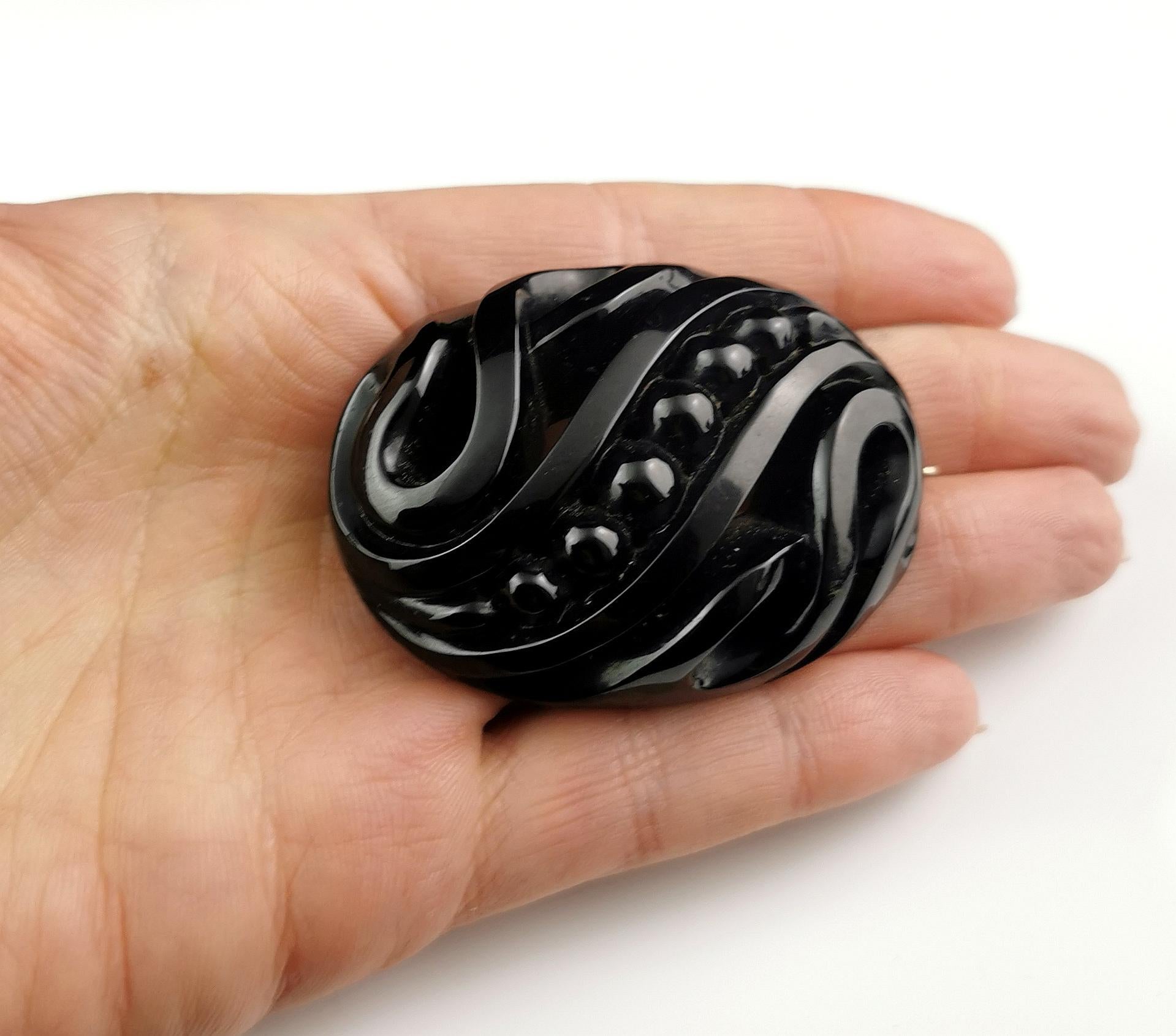 A gorgeous antique Victorian era Whitby Jet brooch.

It is an oval shaped brooch with swirl designs and beading going across the centre.

Very finely carved and polished to a high glossy shine.

A very attractive brooch.

Whitby Jet shot to