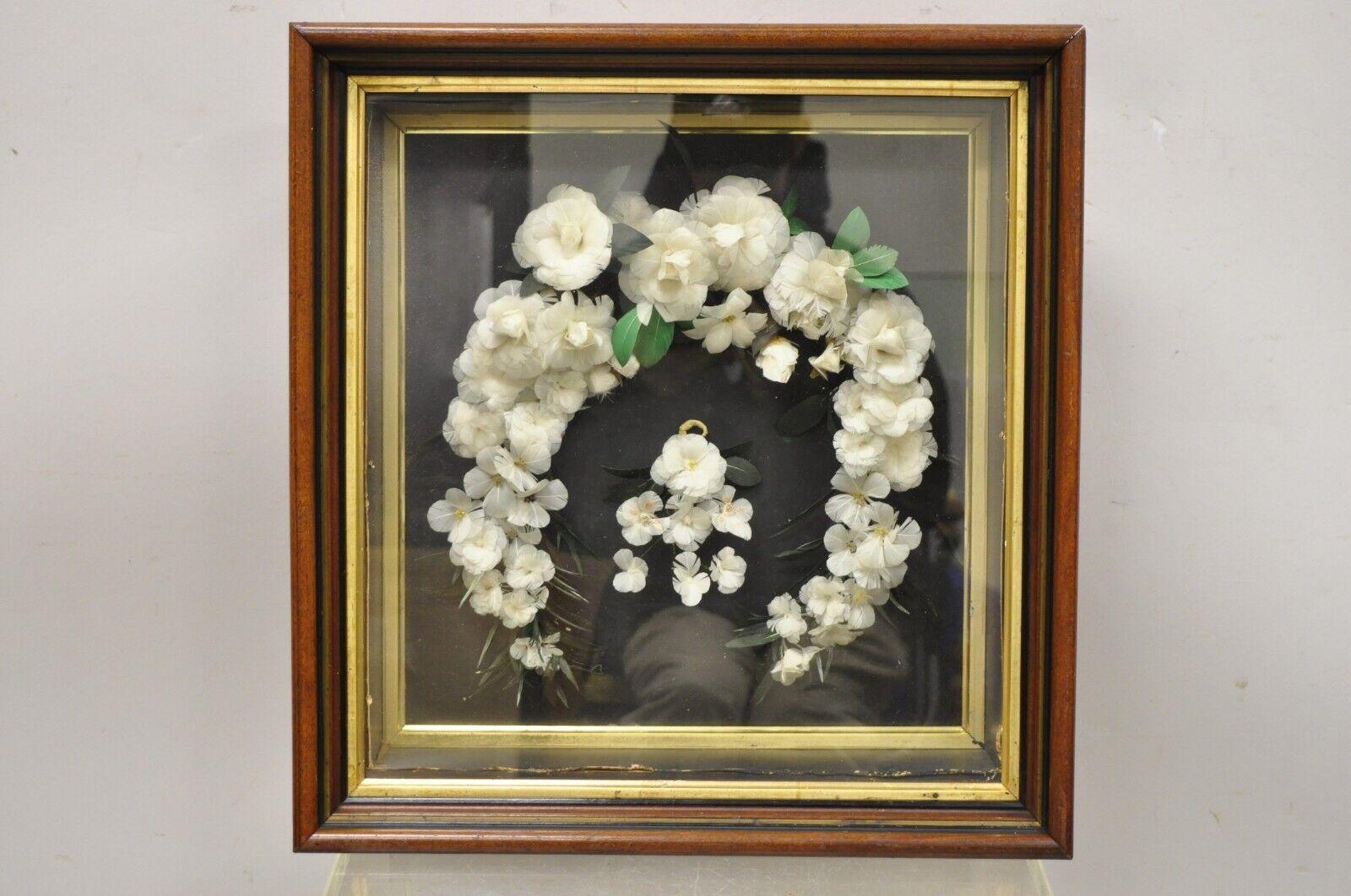 Antique Victorian white feather floral mourning wreath mahogany wood shadow box. Item features an ornate white feather flower arrangement, mahogany wood frame, glass front, very nice antique item. Circa 19th Century. Measurements: 18.5