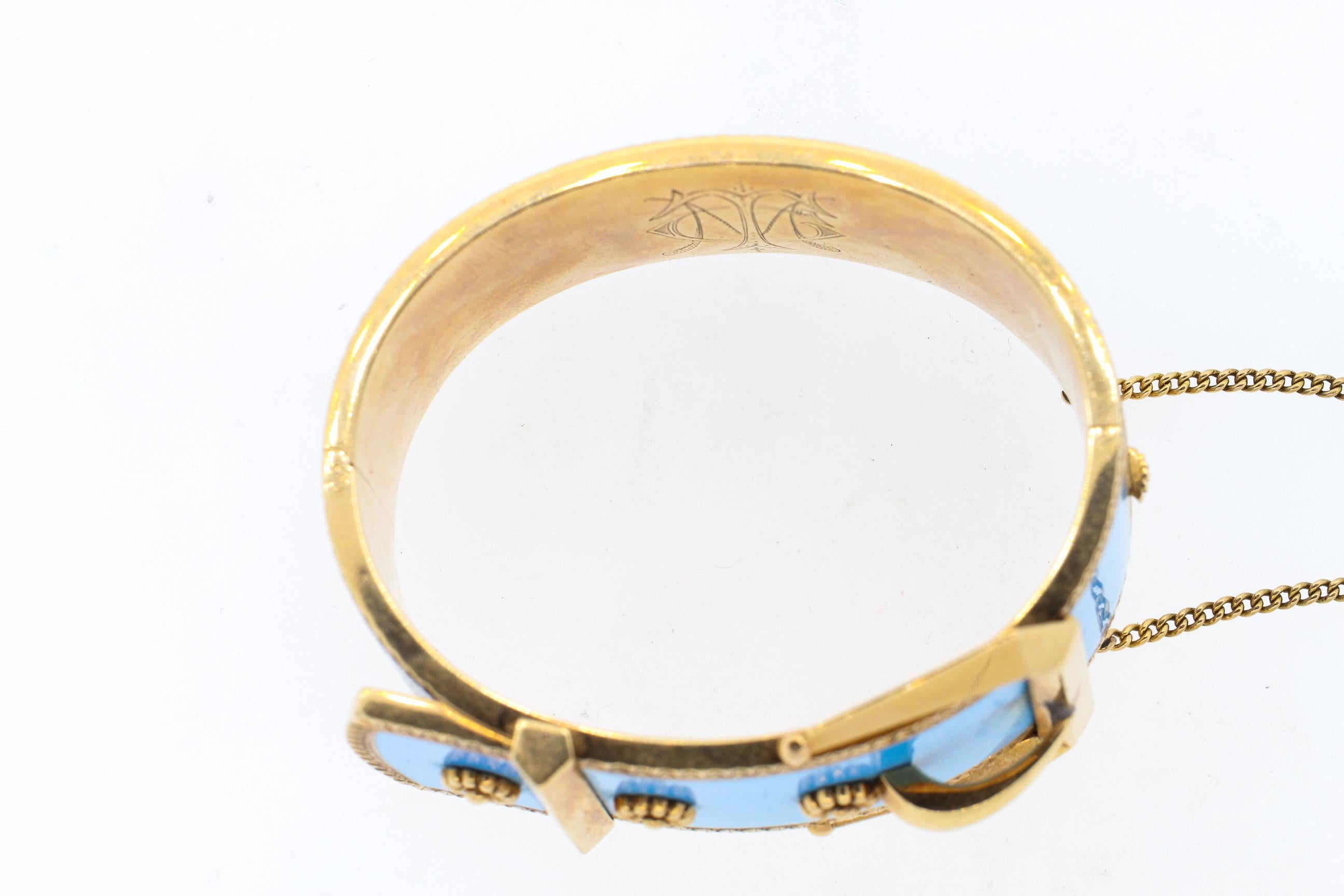 High Victorian wide robins egg blue enamel buckle bangle bracelet, circa 1880. This bracelet is in beautiful condition, with no chips to the vibrant turquoise blue enamel. The buckle motif is incredible modern in feel and this bracelet is very