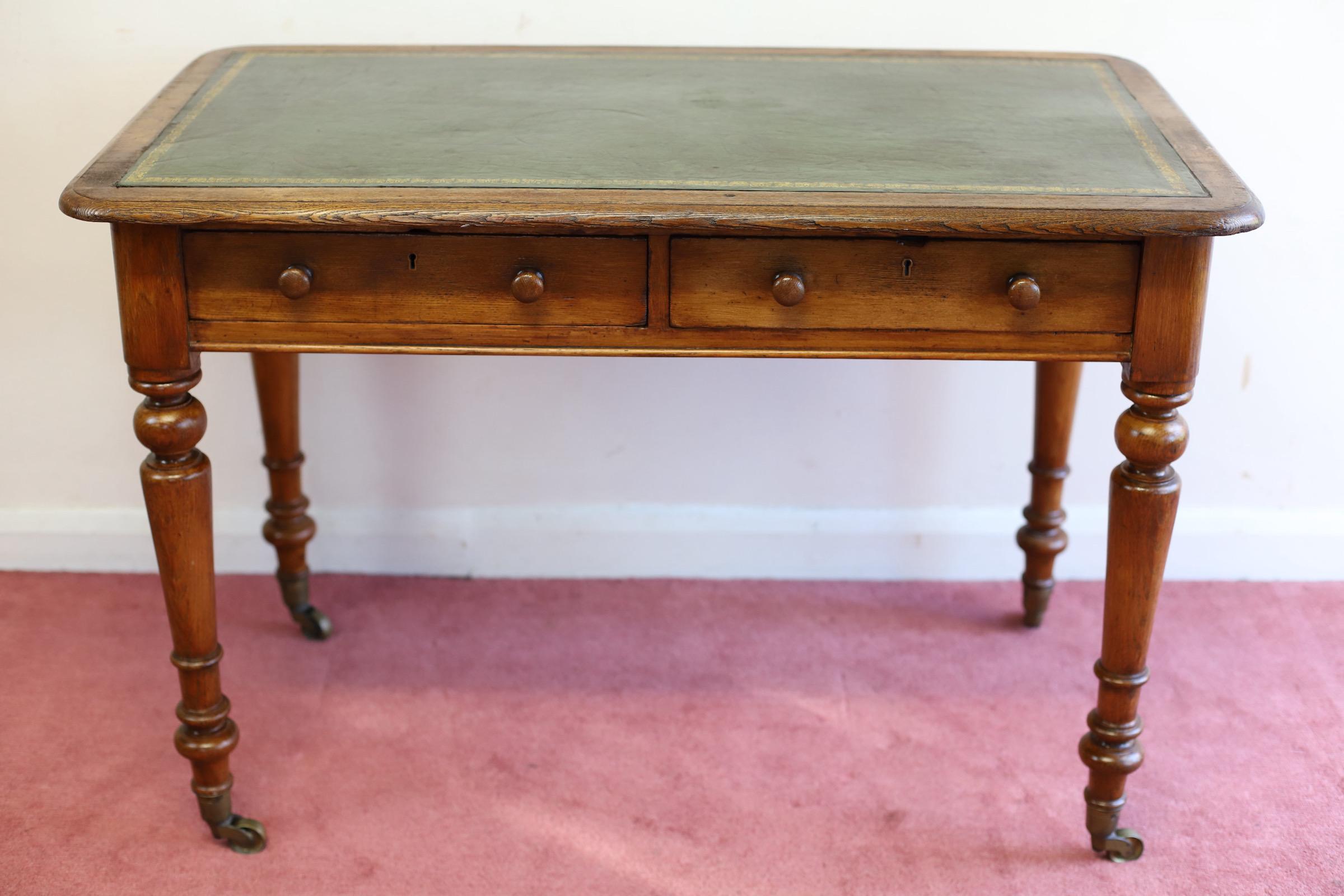 We delight to offer for sale this antique victorian oak library table, moulded top with gilt tooled leather, two drawers below with lip moulded edges and turned knobs. Raised on turned legs and brass castors.
Circa. 1850
Don't hesitate to contact me