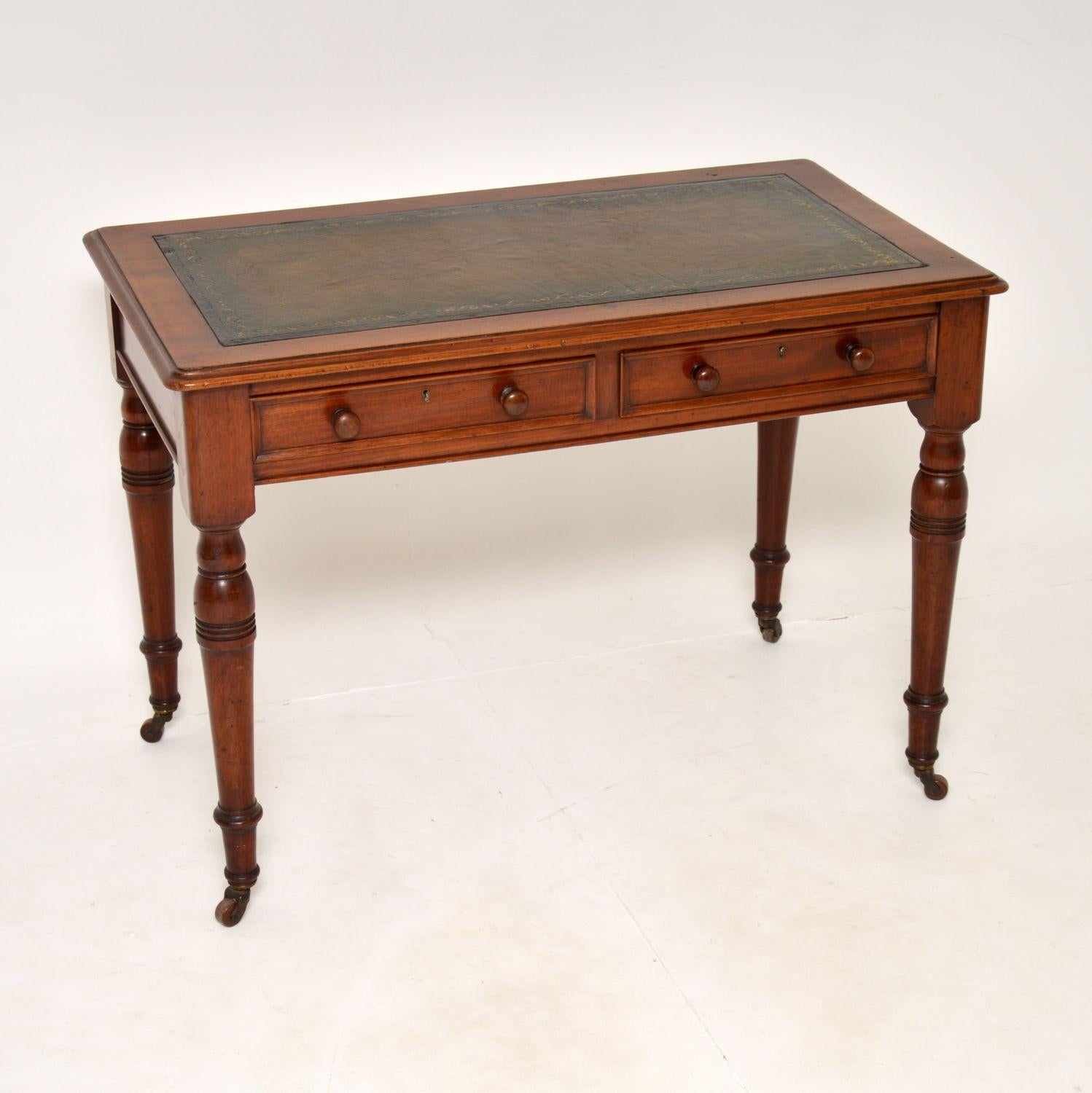 A charming and very useful original antique Victorian writing table. This was made in England, it dates from around the 1860-1880’s.

It is a great size and is beautifully finished on all sides, so can be used as a free standing item. The inset