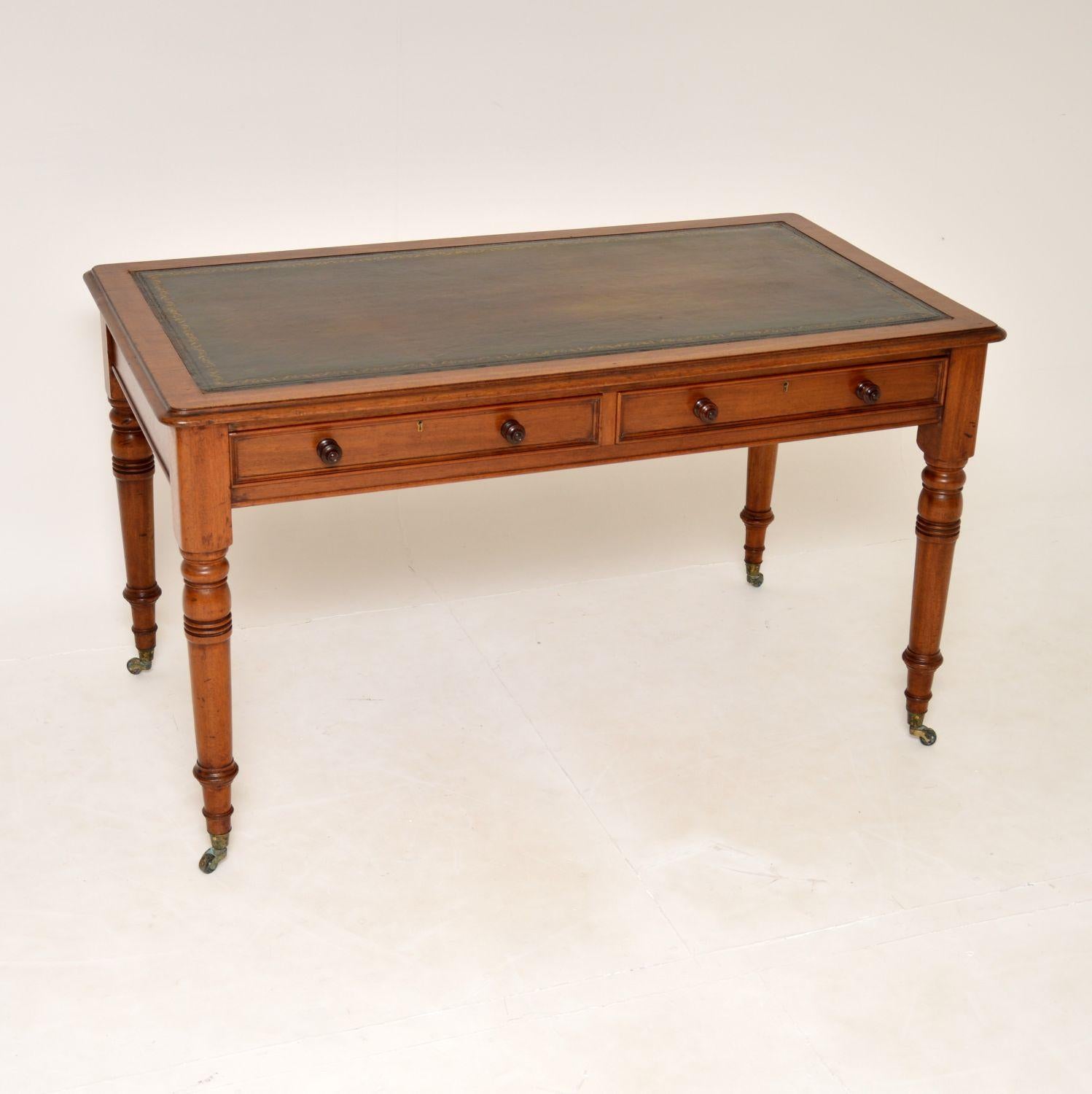 An excellent original antique Victorian writing desk. This was made in England, it dates from the 1860-1880’s.

The quality is superb, this sits on turned solid wood legs with original brass casters. The drawers have nice beading around the edges