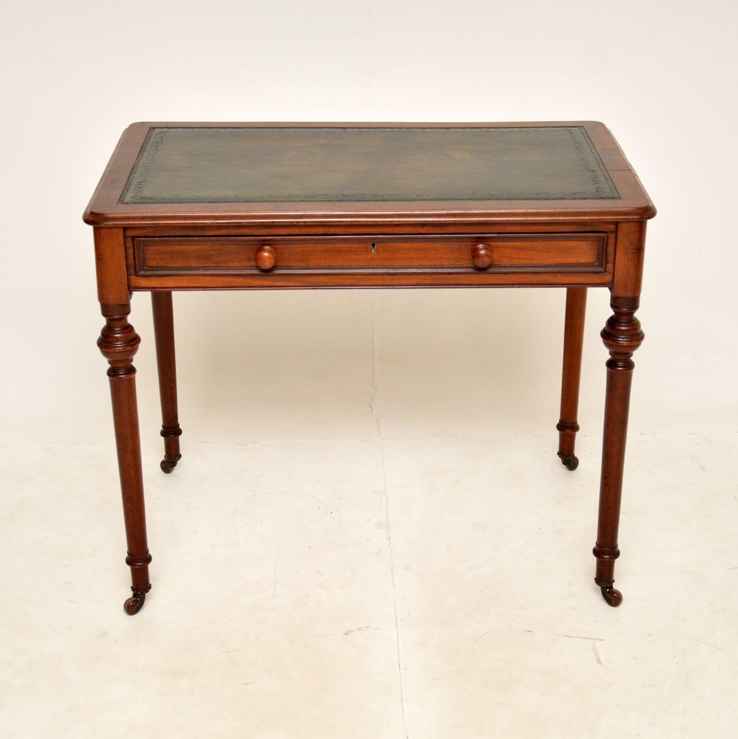 A smart and very well made antique Victorian period writing desk. This was made in England, it dates from around 1860-1880.

It is of great quality and is a very useful size. The inset leather to is hand coloured and gold tooled, there is a single