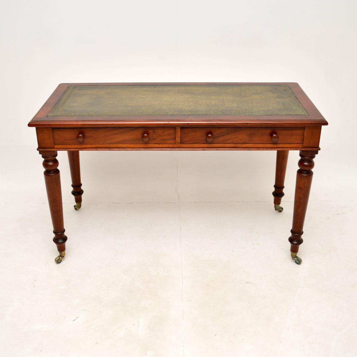 A smart and extremely well made antique Victorian writing table / desk. This was made in England, it dates from around the 1860-1880 period.

It is of superb quality and is a very useful size. The inset leather top is hand coloured with tooled