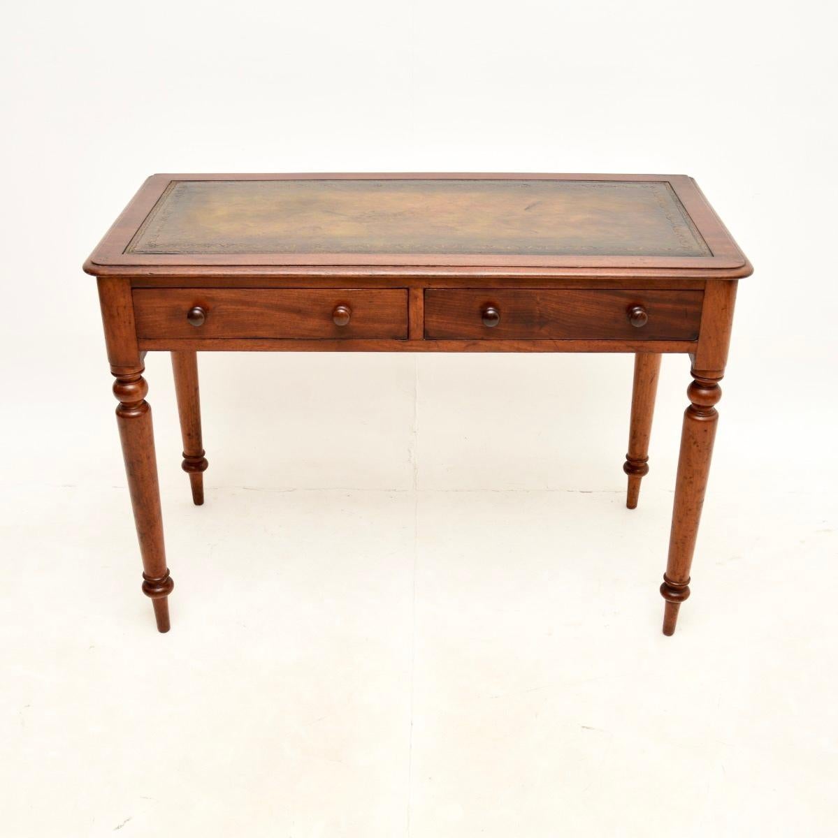 A smart and very useful antique Victorian writing table / desk. This was made in England, it dates from around the 1860-1880 period.

It is very well made and is a very useful size, not too deep from front to back. The inset leather writing surface