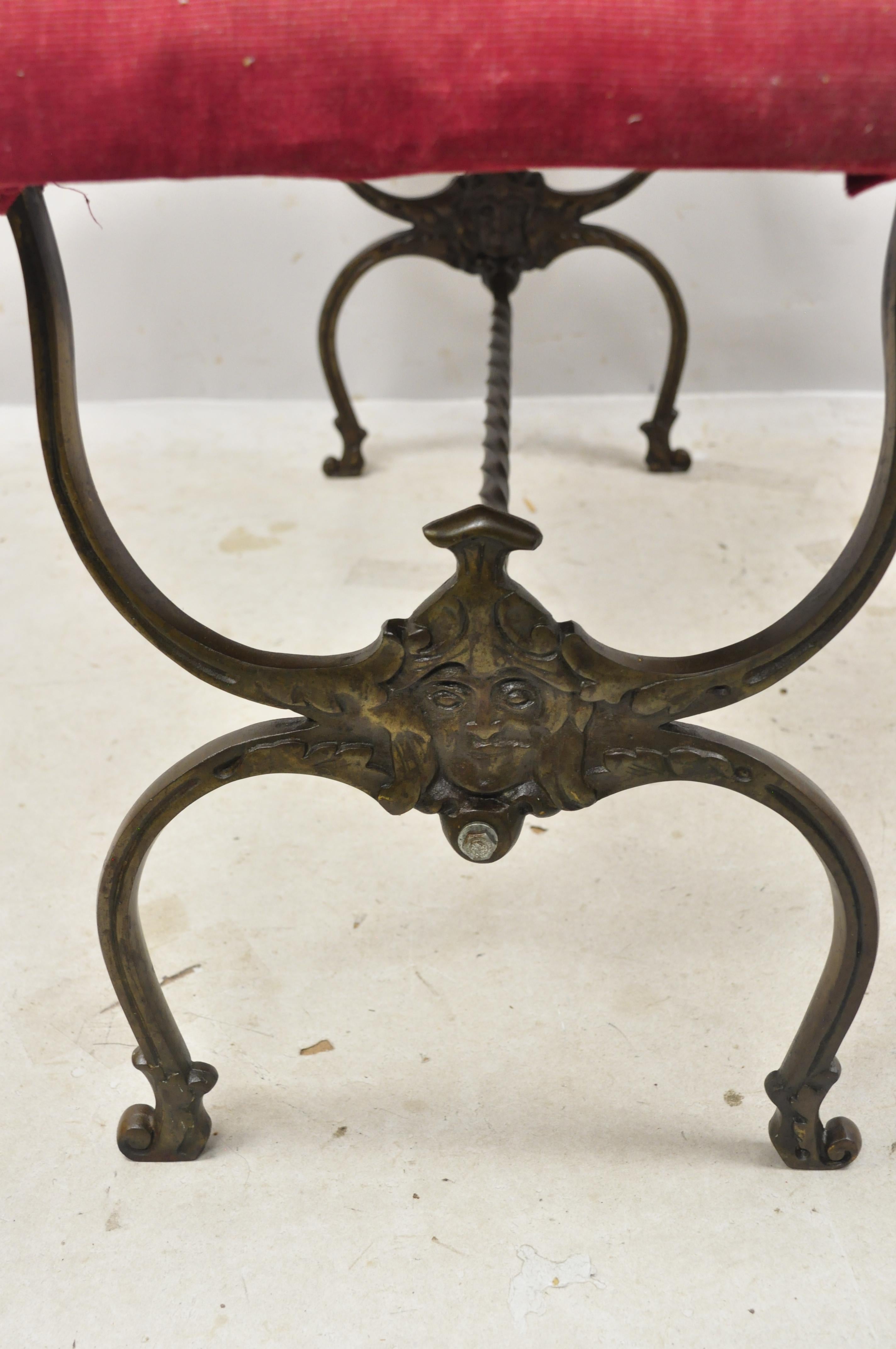 North American Antique Victorian Wrought Iron Figural Bench with Faces and Twisted Stretcher