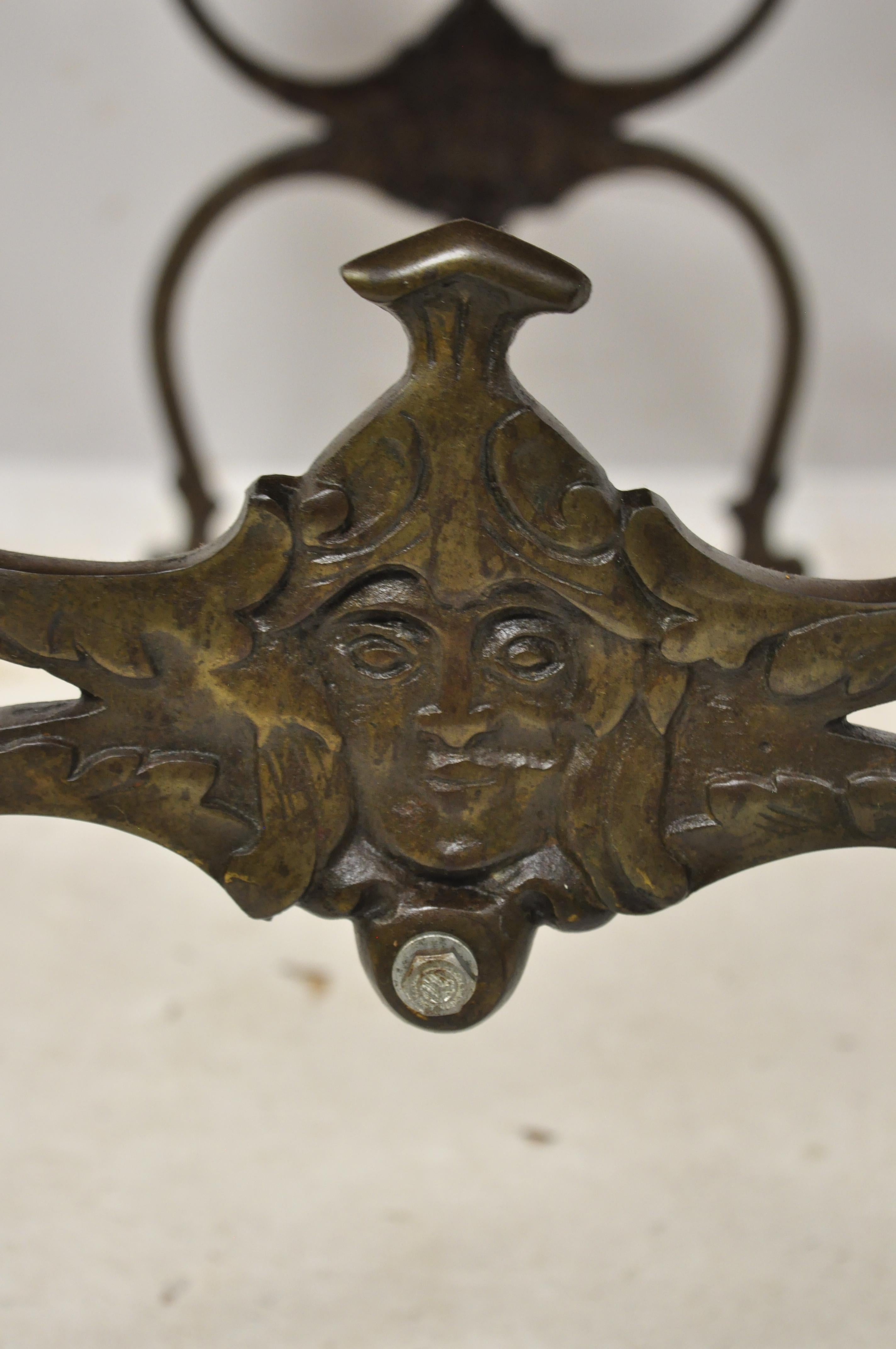 Antique Victorian Wrought Iron Figural Bench with Faces and Twisted Stretcher In Good Condition In Philadelphia, PA