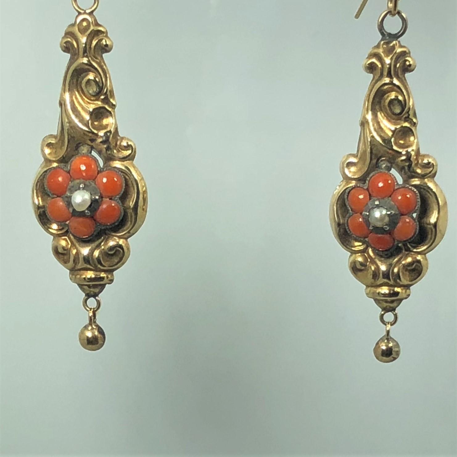 Antique Victorian Yellow Gold Coral and Seed Pearl Earrings. These magnificent true antique/Victorian earrings are created in approx. 15 karat yellow gold, weight 4.2 grams. Adorned with 12 red coral - 6 round cut coral on each piece, and 2 round