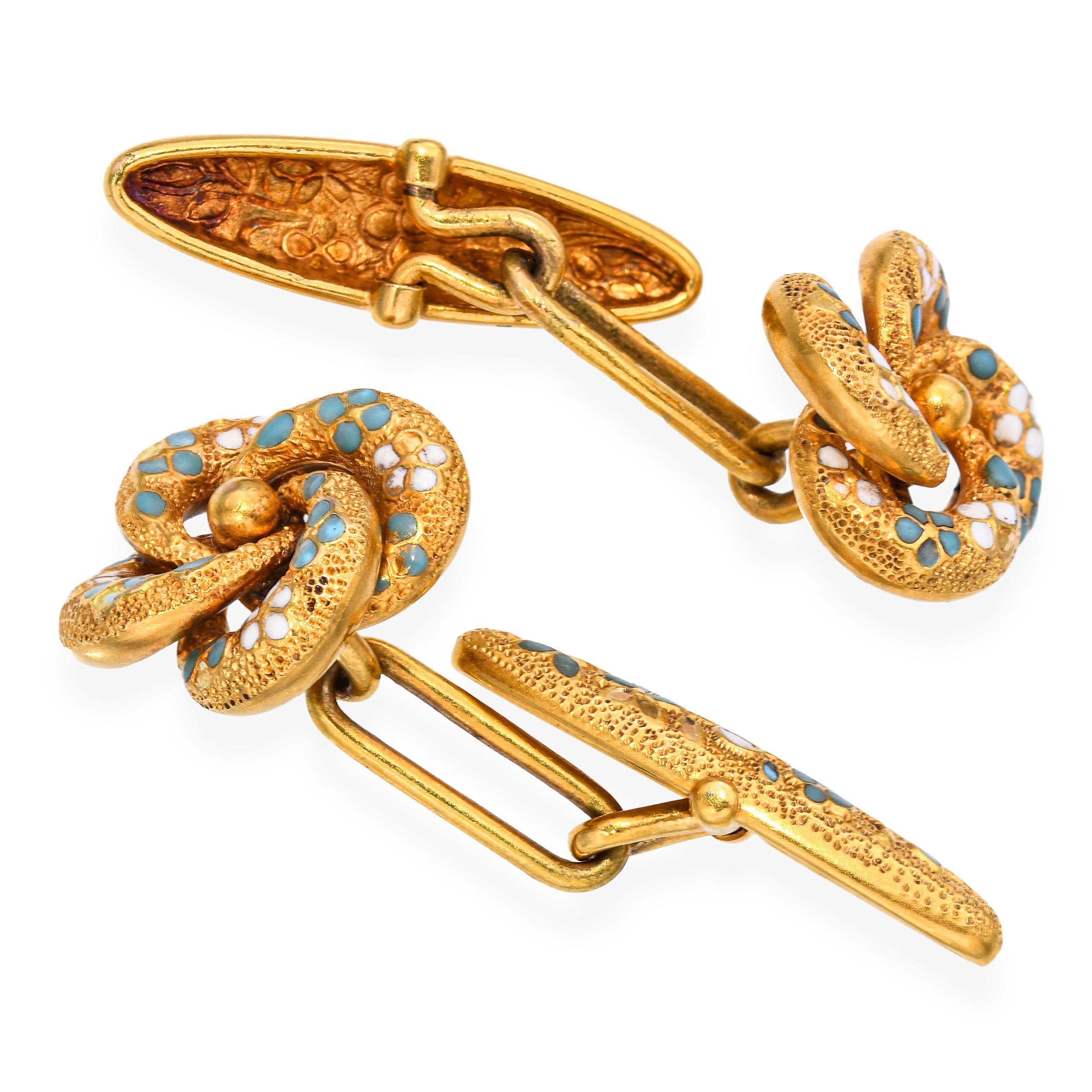 These exquisite Antique Victorian cuff links are crafted in solid 14k yellow gold with a high karat plating feature an elegant love knot design, symbolizing eternal affection and unity. Each face is intricately detailed with turquoise blue and white