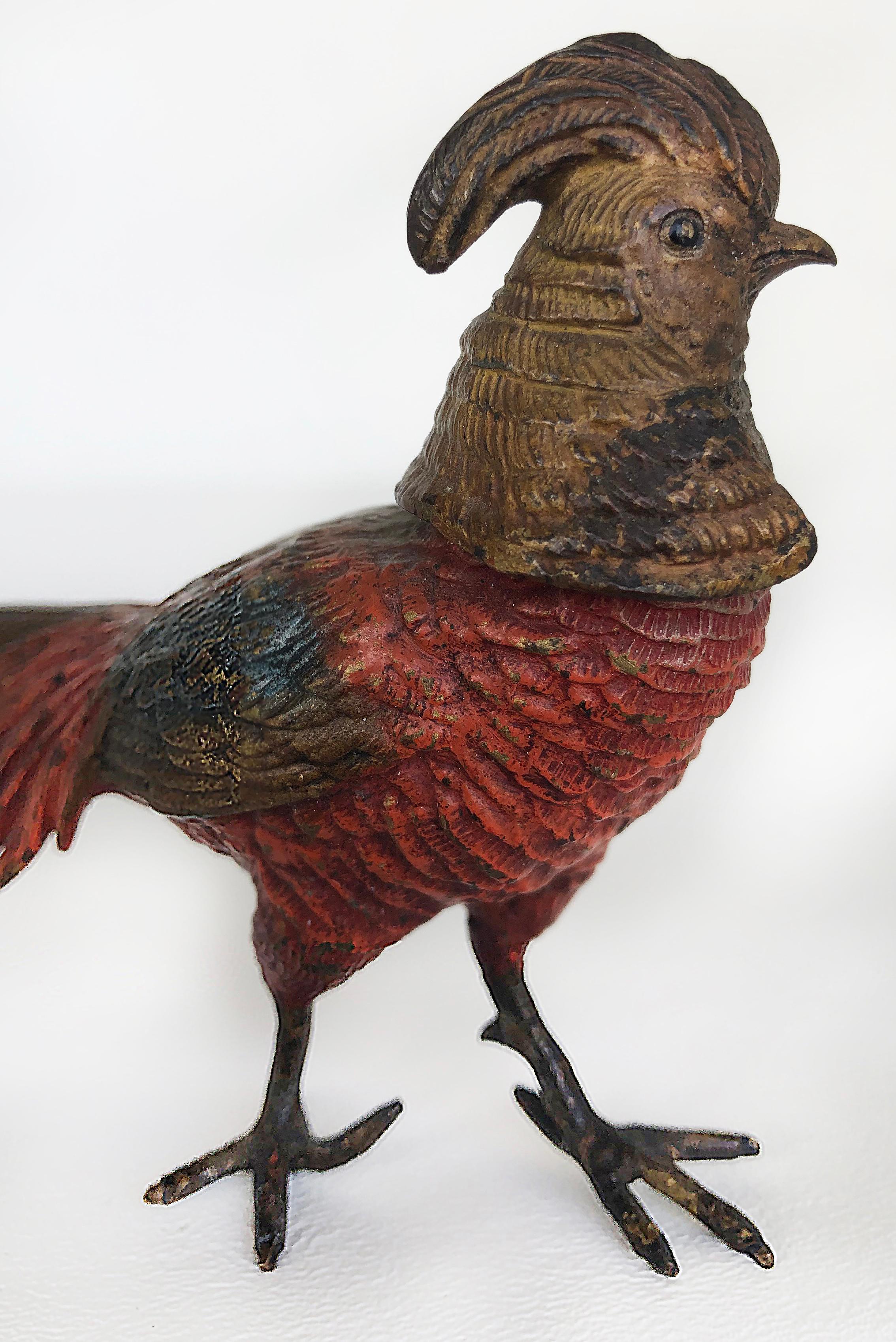Antique Vienna cold-painted bronze pheasants, a pair

Offered for sale is a pair of Viennese cold-painted bronze figures of pheasants dating to the early 20th century. The pheasants show some age wear with losses to the paint finishes.
