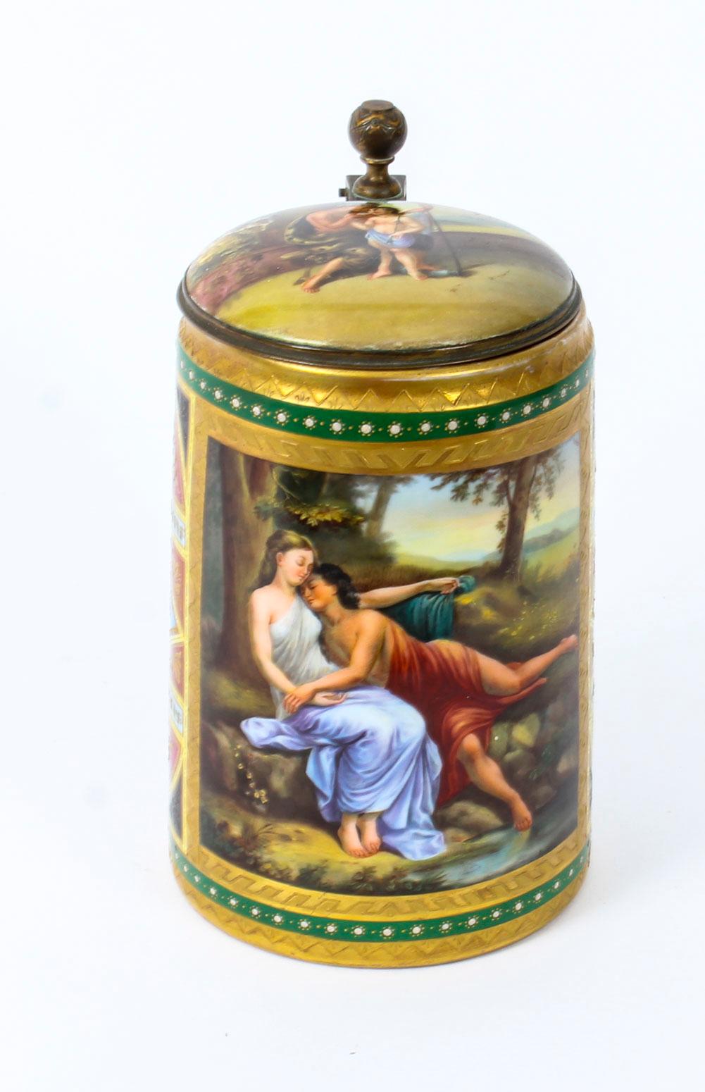 This is a stunning and rare antique Royal Vienna porcelain lidded tankard, dating from the late 19th century.
 
This magnificent tankard features the exquisite mythological characters of Amor and Psyche, titled 'Amor u. Psyche