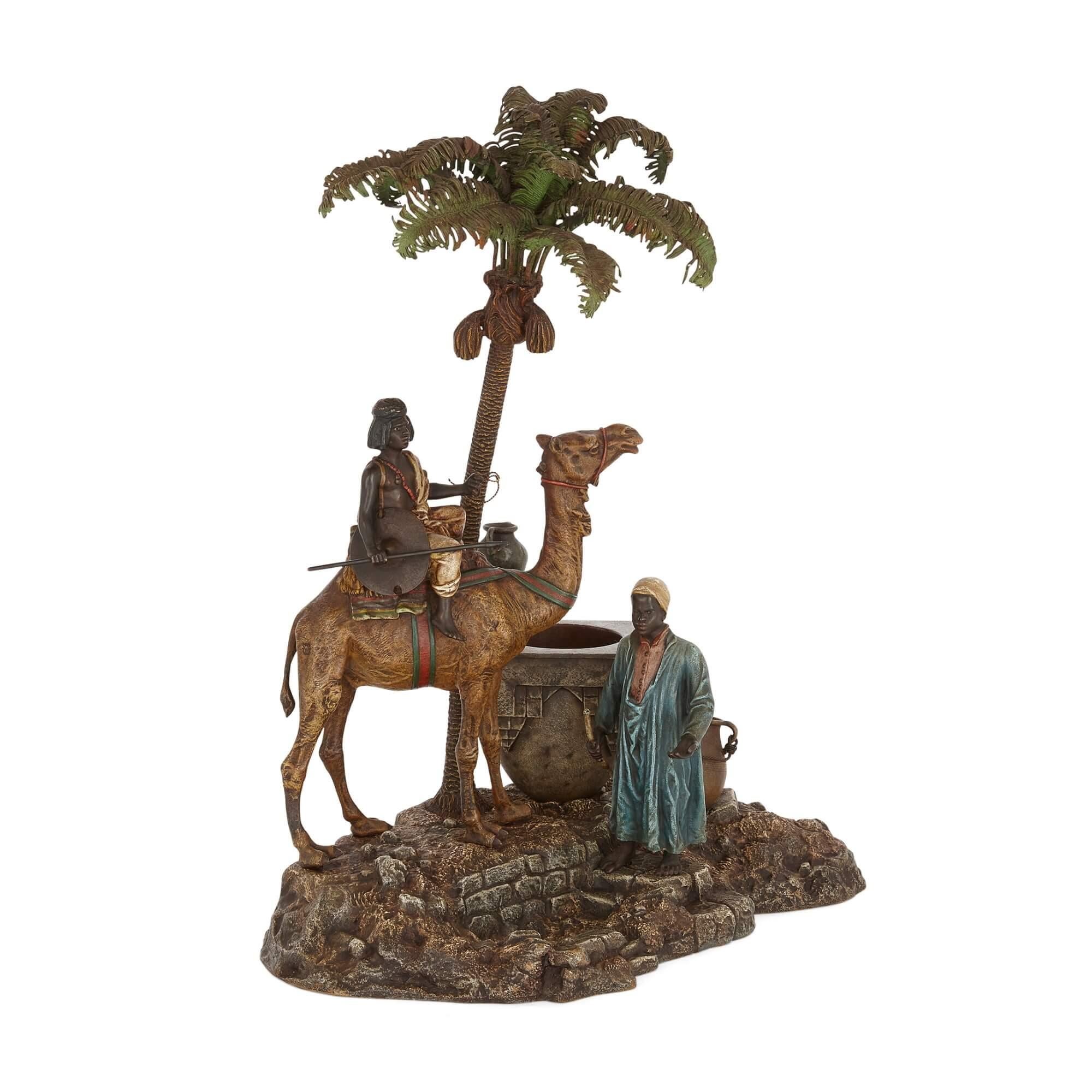 Antique Viennese cold-painted bronze sculpture with a camel by Bergman 
Austrian, c. 1910
Height 39cm, width 31cm, depth 20cm 

Franz Xaver Bergman (1861-1936) is the artist behind this unusual sculptural desk piece. 

A camel stands majestically