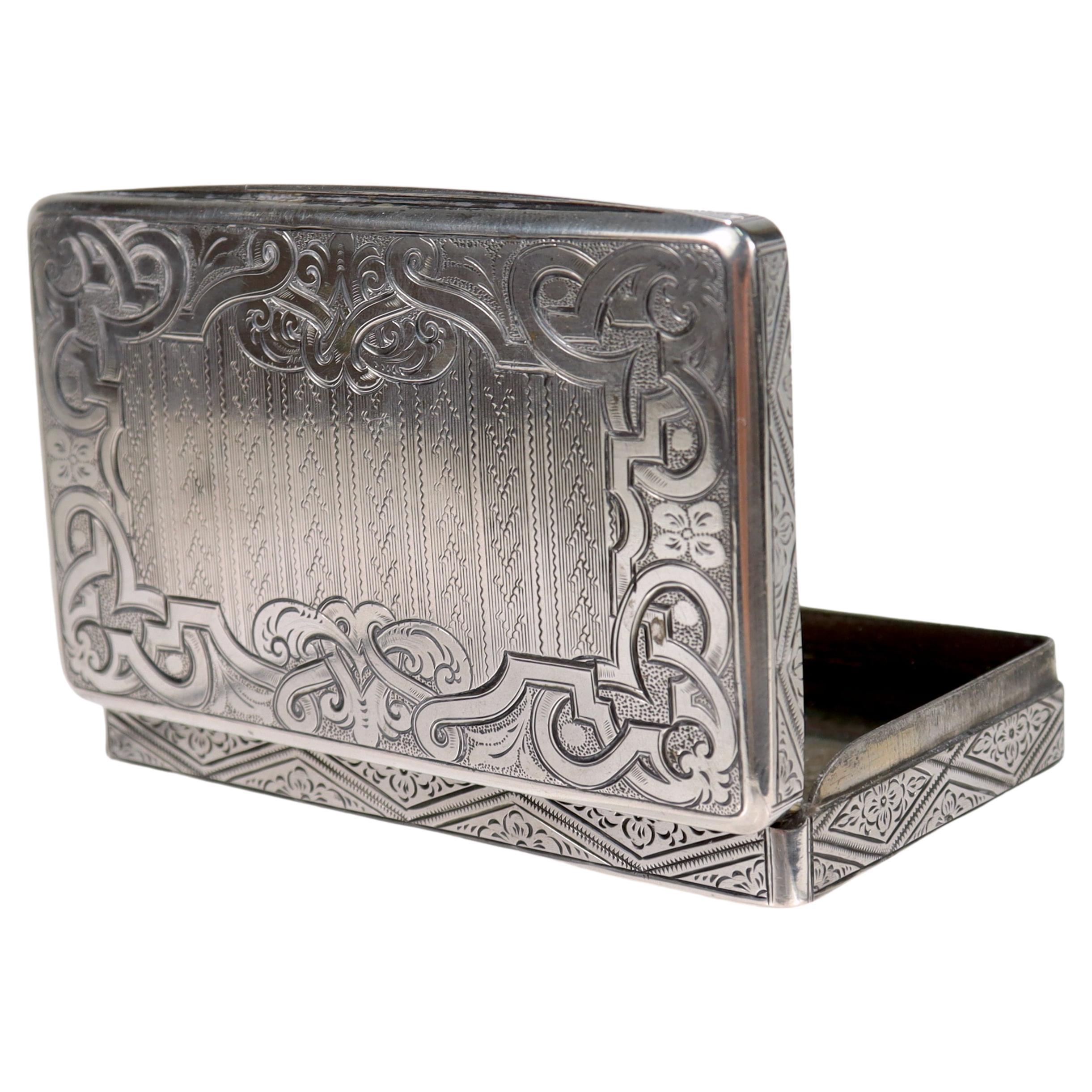 A fine antique silver card case or snuff box.

With engine turned engraved decoration throughout.

Marked with an Austrian silver assay mark for 13 Loth, Vienna, and 1856, along with a maker's mark 'HV'. 

Simply a lovely silver snuff or card
