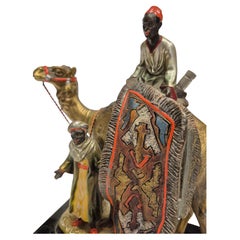 Antique Viennese table lighter made of cold-painted bronze with carpet seller