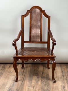 Antica sedia a bracci in noce viennese con sedile a canna c.. Fine del XIX secolo