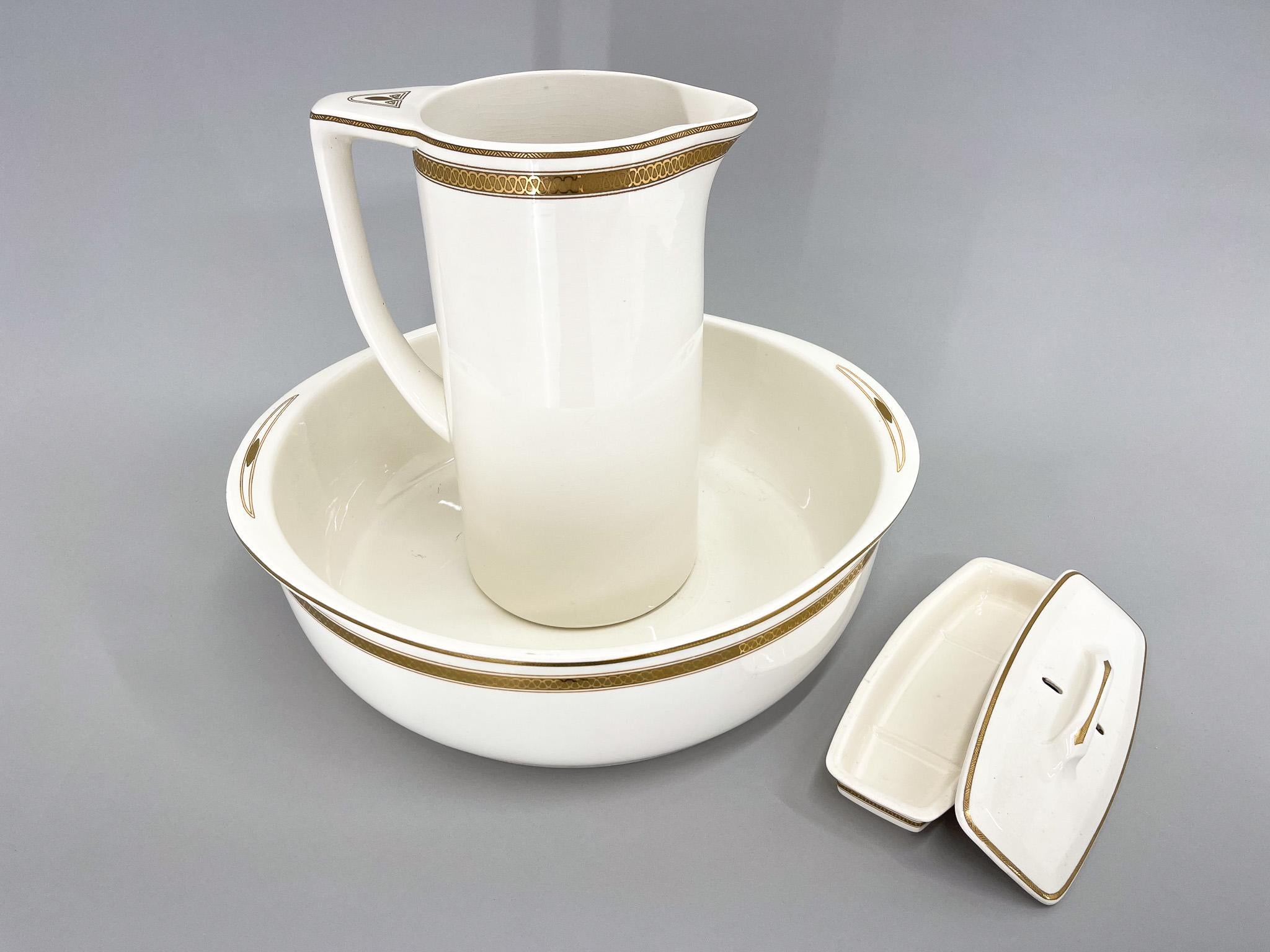 Set of three antique pieces of Villeroy&Boch bathroom set. The wash bowl is 12,5 cm high, 40 cm in diameter (44 wide with handles). The pitcher is 31 cm high, 24 cm wide (with handle) and is 16 cm in diametr. The soap container is 6 cm high, 23,5 cm