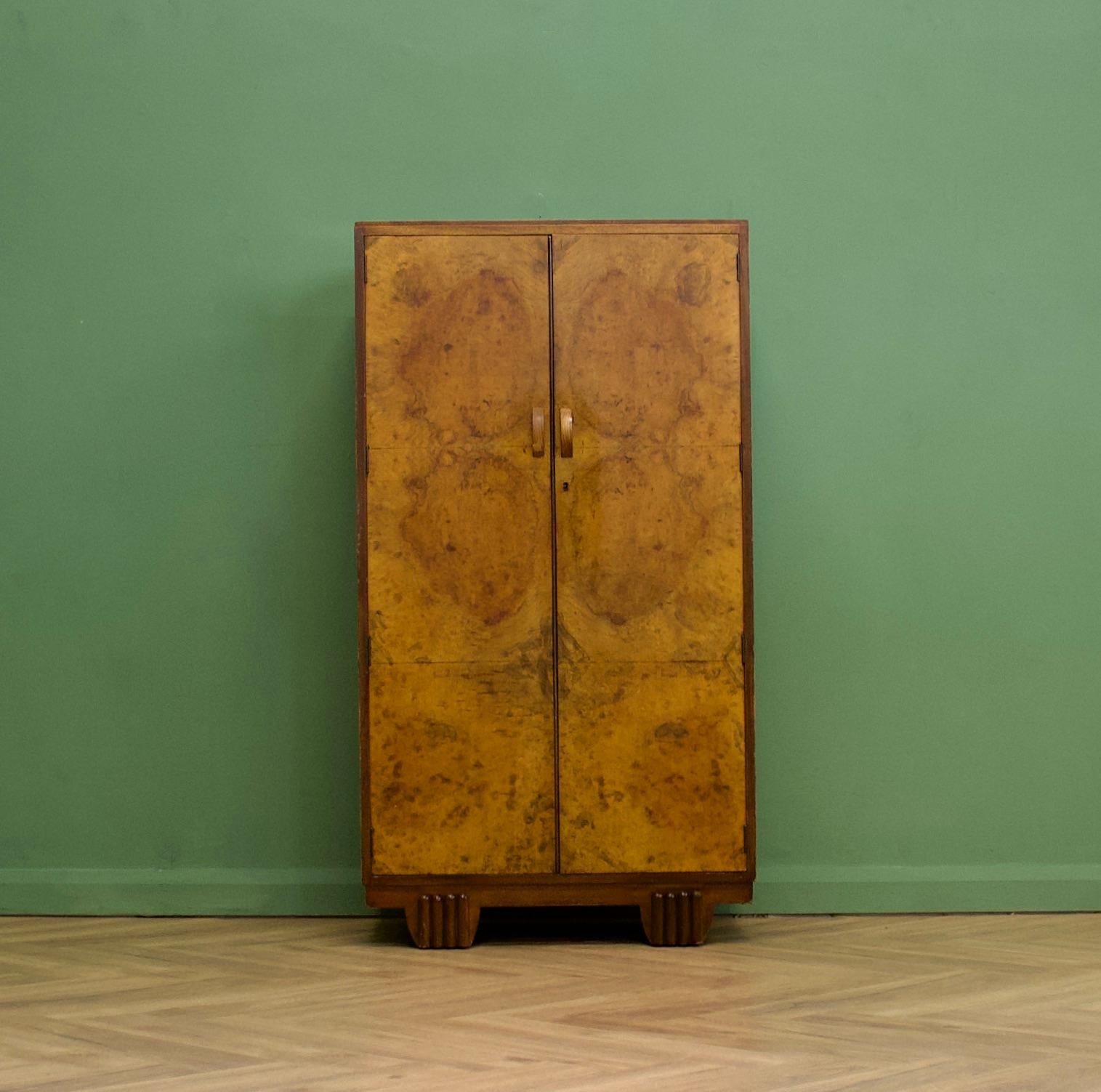 An impressive quality, 1930's burr walnut compact wardrobe
Featuring a rail to the top, shelves and a shoe rack