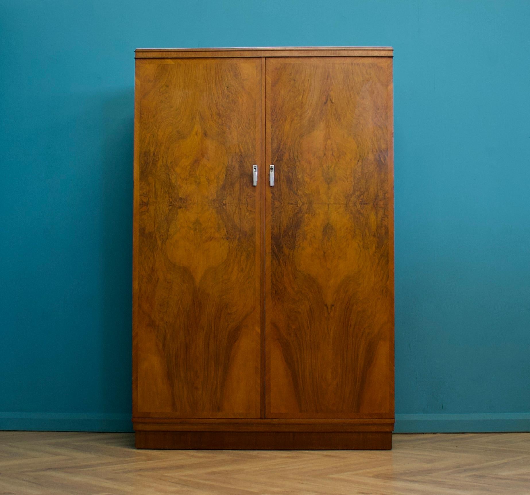 An impressive quality, 1930's burr walnut compactum wardrobe from Verithing


The interior is beautifully fitted out - complete with a pull out clothes rail, shoe rail, drawers and compartments