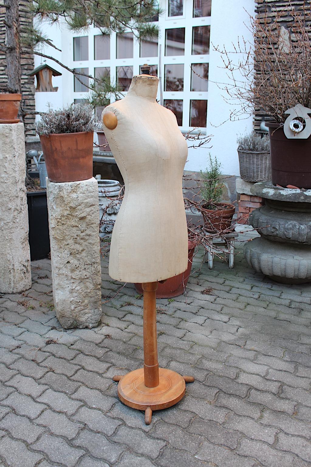 Antique historicsm vintage mannequin tailor´s dummy from beech and linen manufactured circa 1890 Austria.
The vintage mannequin shows a circular base with three feet from beech in light brown.
The body is easy to adjustable from 145 cm to 165 cm