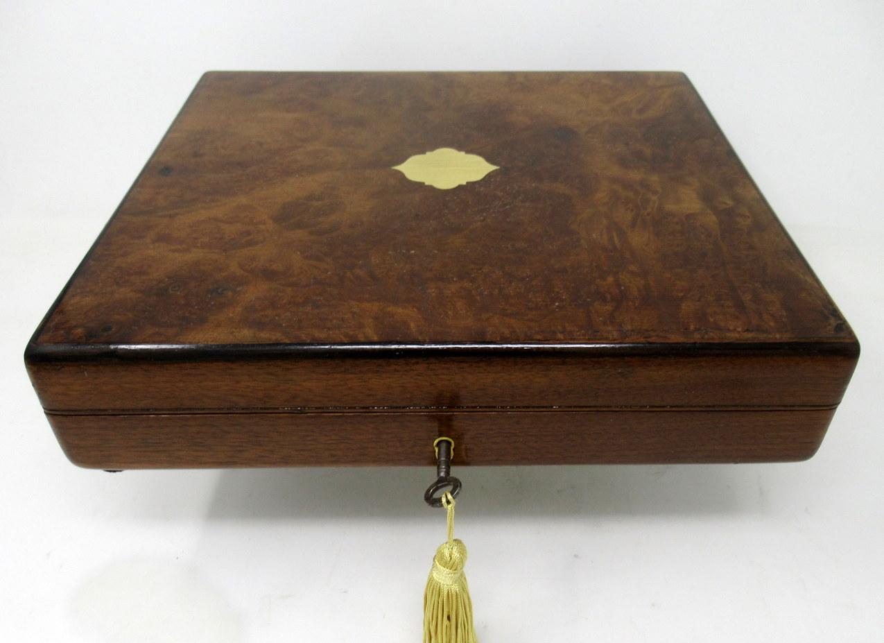 An exceptionally fine quality English well figured solid bur walnut ladies or gentleman's jewelry or storage box of outstanding quality and medium proportions with Retailer's name John Hall & Co. 50 King Street, Manchester, England, began in