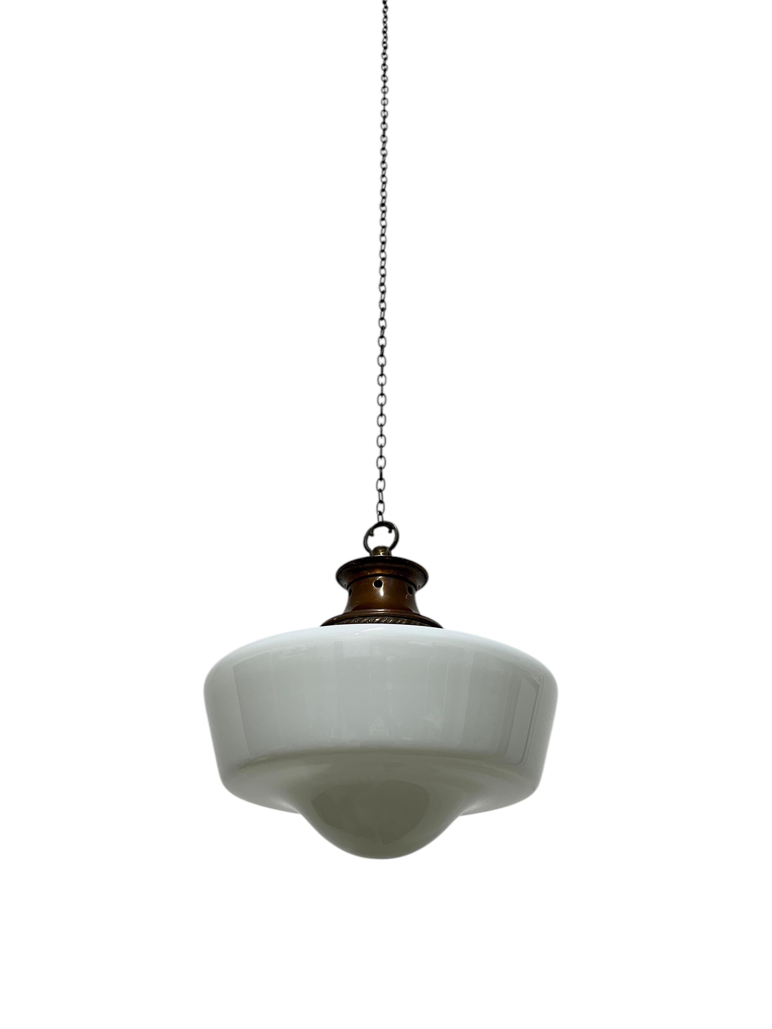 - A beautifully shaped opaline ceiling pendant with original gallery, England circa 1930.
- Unusual shape to the glass shade, aged copper gallery with decorative detail and remnants of a varnish throughout.
- Rewired with brown braided flex and PAT