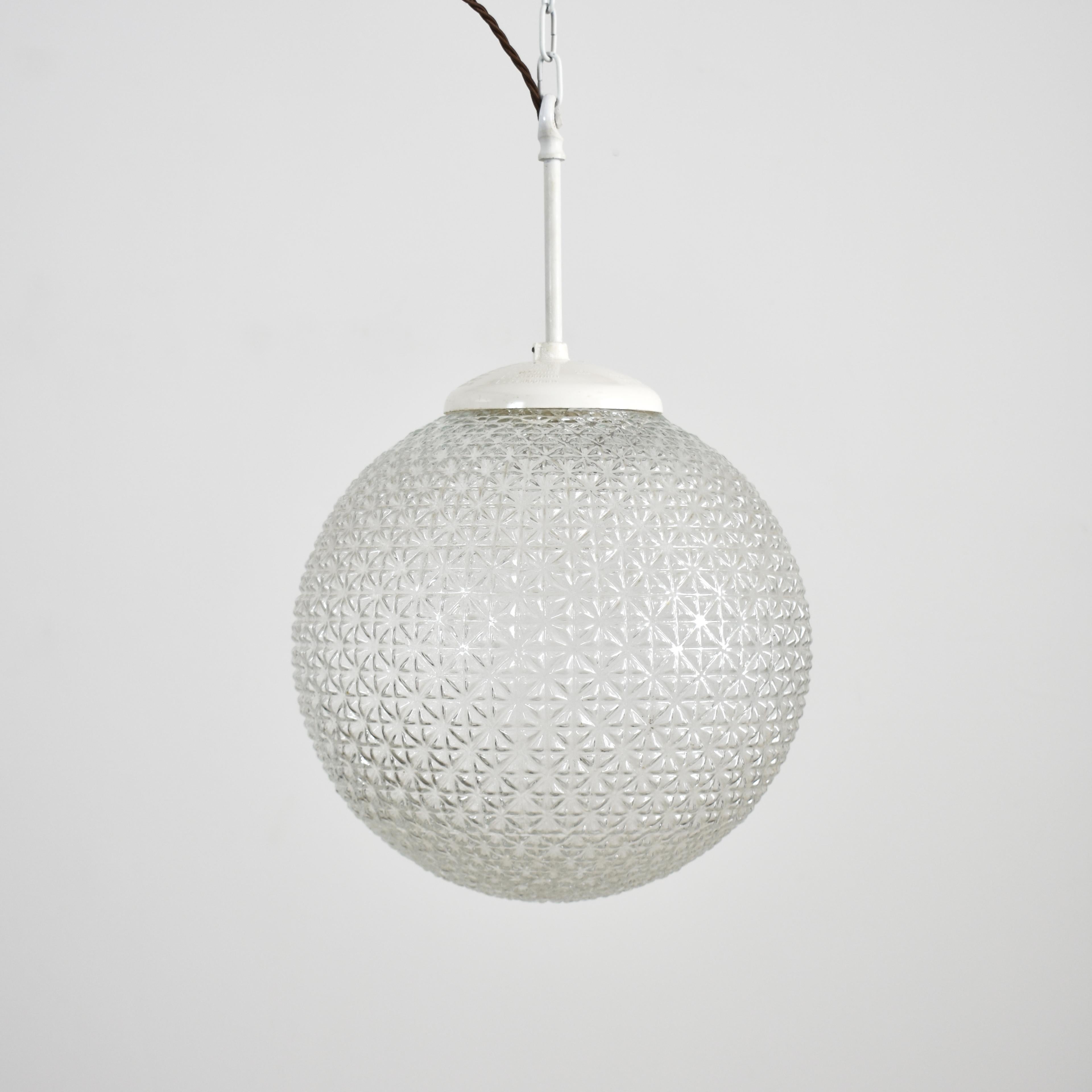 Czech antique glass pendant light large – A

These unique glass pendants were salvaged from a school hall in former Czechoslovakia, featuring unique cross-cut diamond glass. The glass provides a striking even glow when illuminated. The light