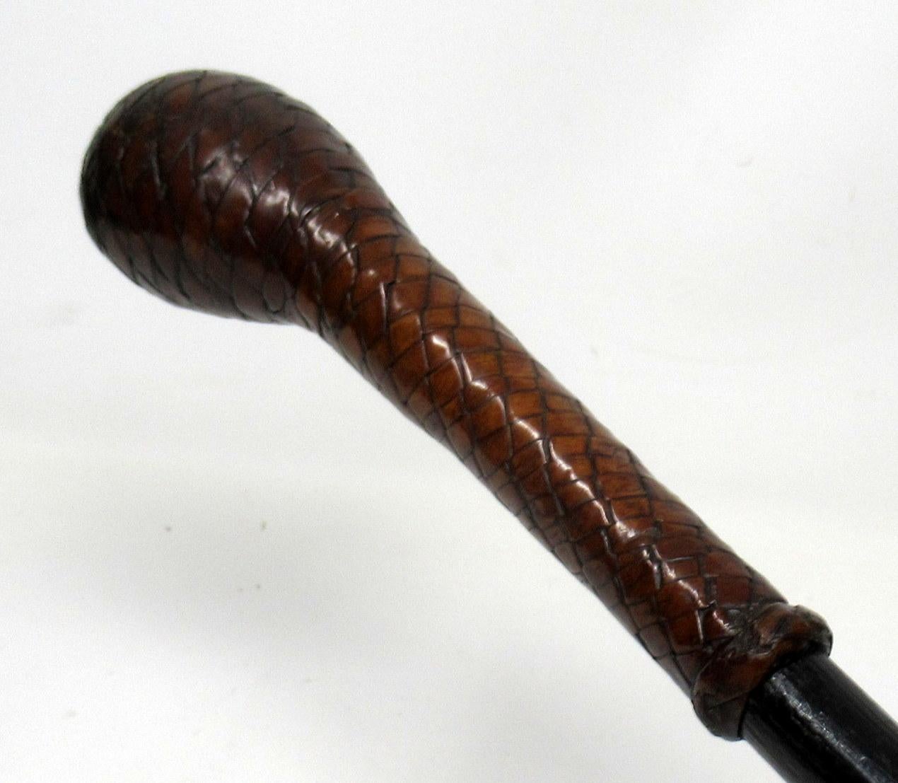 A superb example of an ebonized walking stick, last quarter of the 19th century.

The plaited leather encased Pistol form grip handle above a tapering ebonised shaft complete with its original extra long bi-metal ferrule. 

Condition: Good