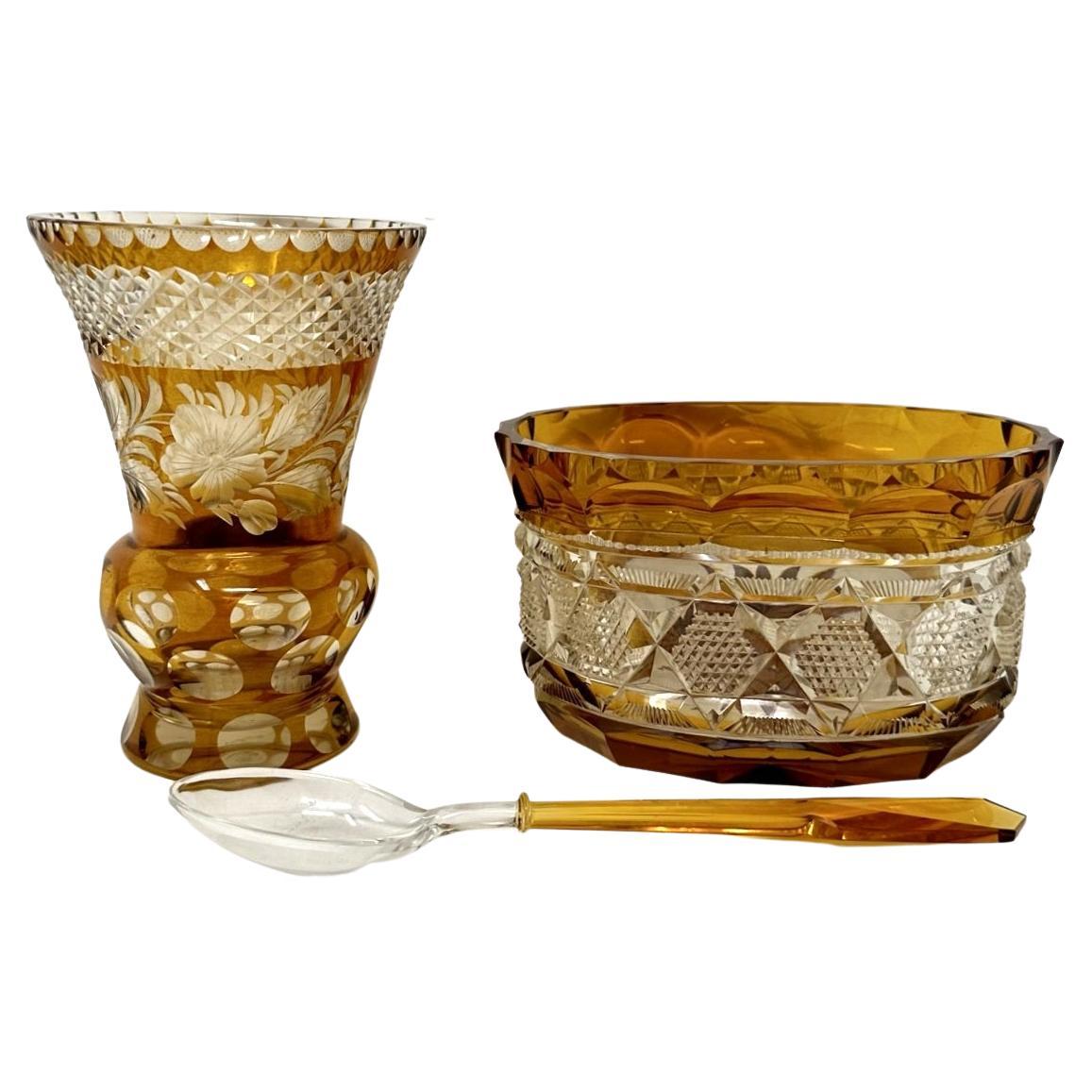 Stunning example of a collection of Moser style Bohemian Amber heavy gauge cut crystal glass Vase of bulbous form with a deep flaired rim and an exquisite oval bowl, late Nineteenth, early 20eth century. 

Each piece has been skillfully handcut