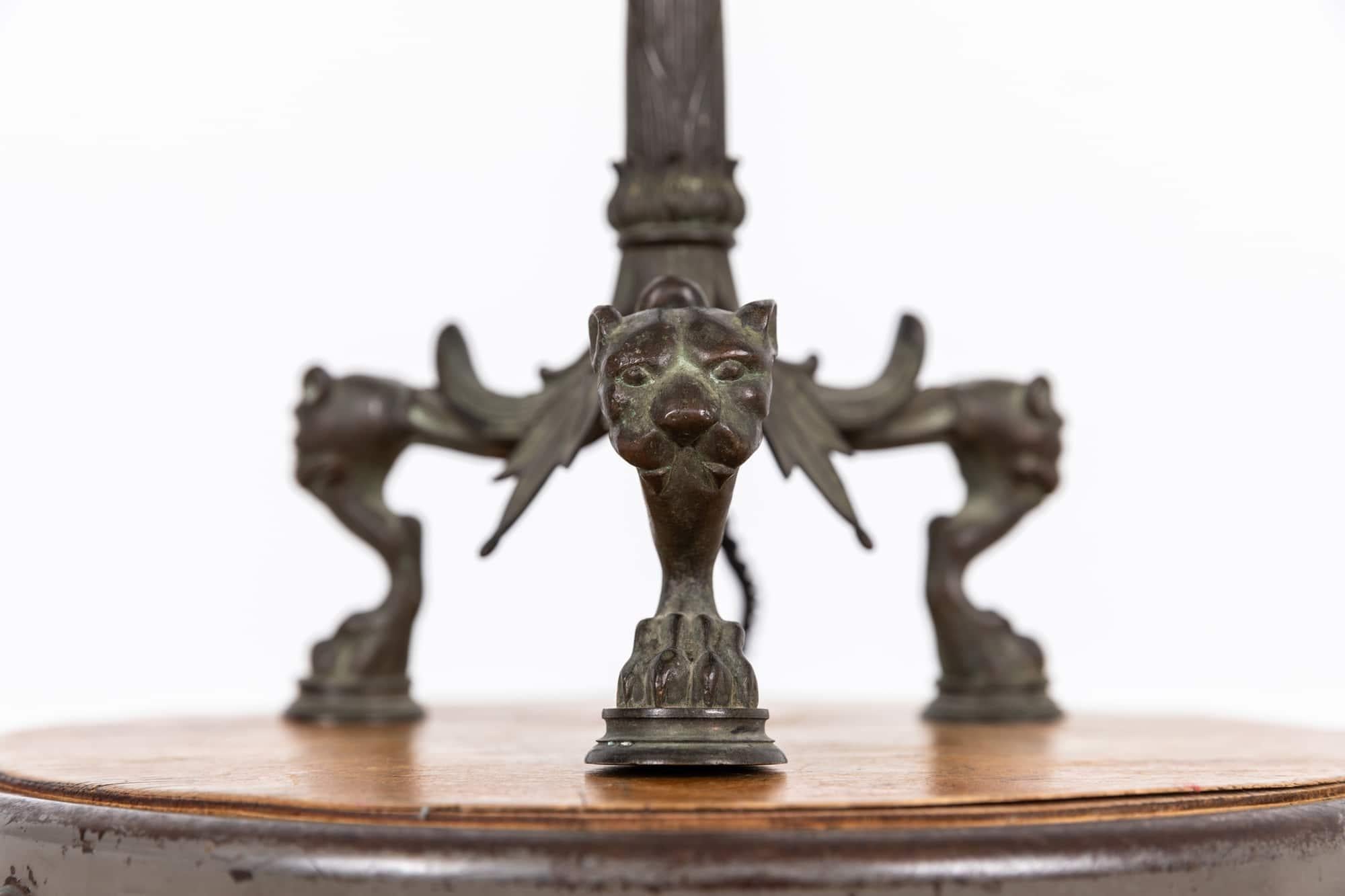 

A very elegant brass French empire converted candlestick table lamp. c.1900

Cast brass of the highest standard with some very fine details beautifully picked out, including the lions head and paw foot legs. One leaf missing to the base.

Rewired