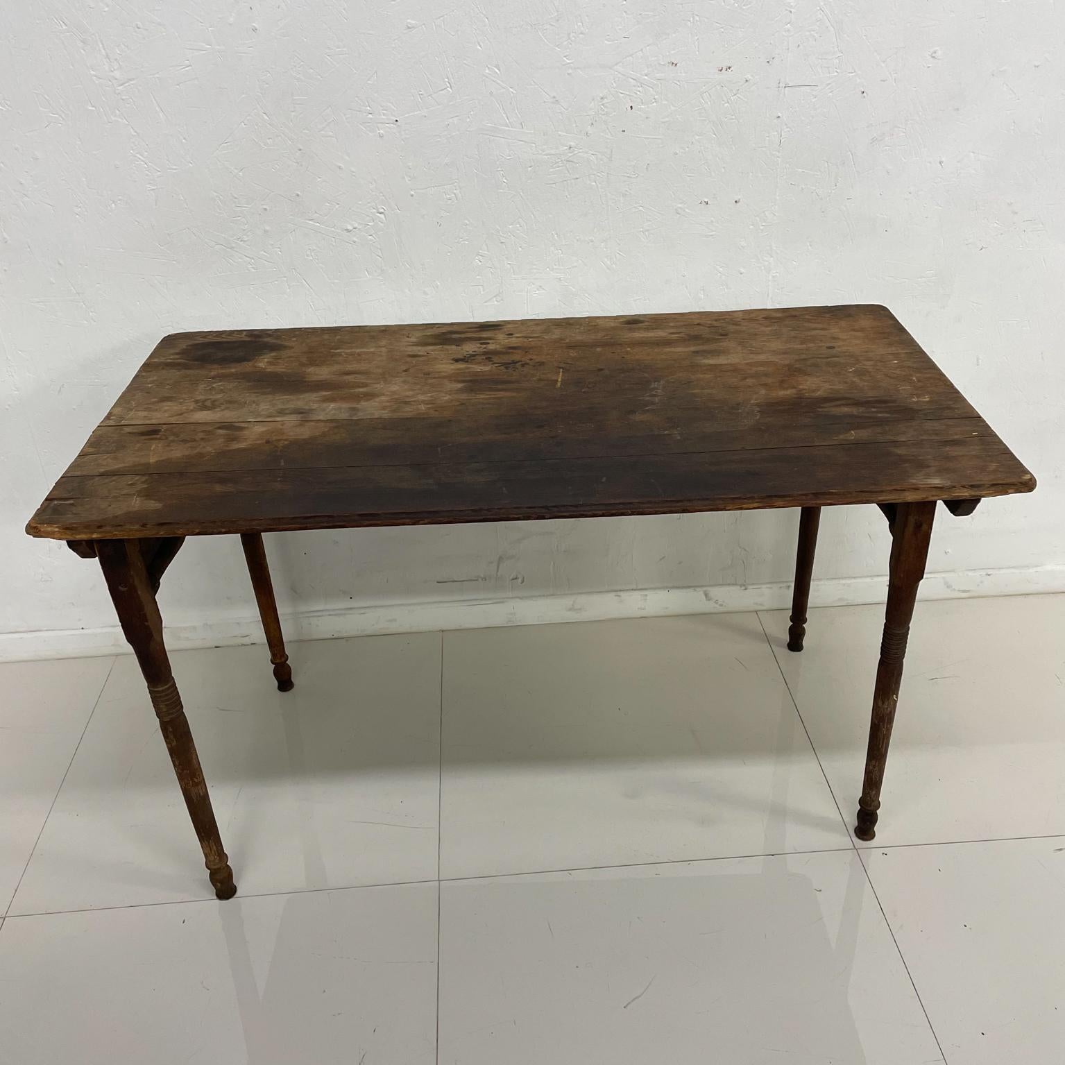 Farmhouse table.
Antique solid wood folding FARM table amazing collapsible system. 
Made in the USA.
Measures: 43.75 W x 23 D 25tall 24.5 knee clearance- folded 43.75 x 23 x 2.38.
Preowned original distressed vintage unrestored condition. Stains