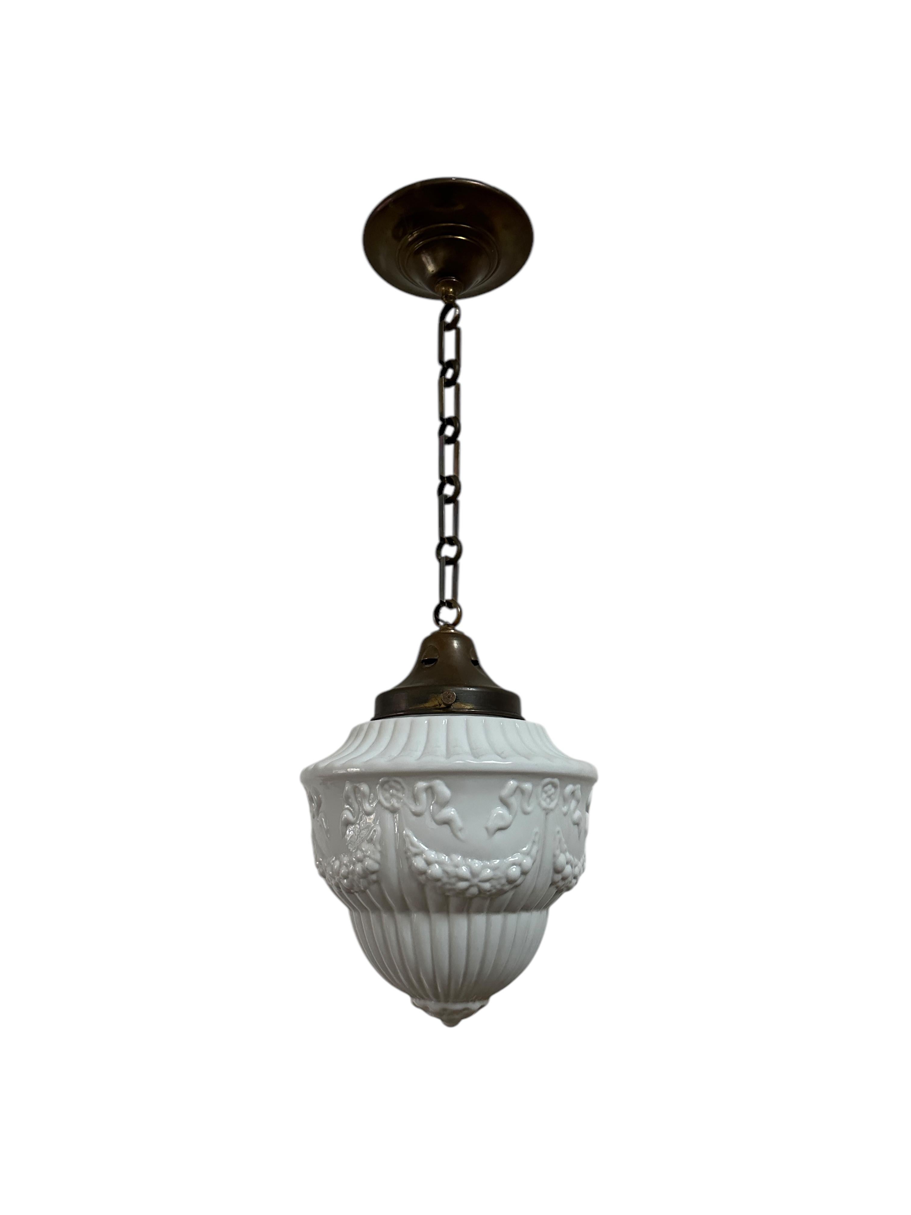 - A large opaline ceiling pendant with original gallery, chain and ceiling rose, France circa 1930.
- Heavy quality glass shade with intricate detail and pattern throughout, the most beautiful aged brass gallery to the top and with original linked