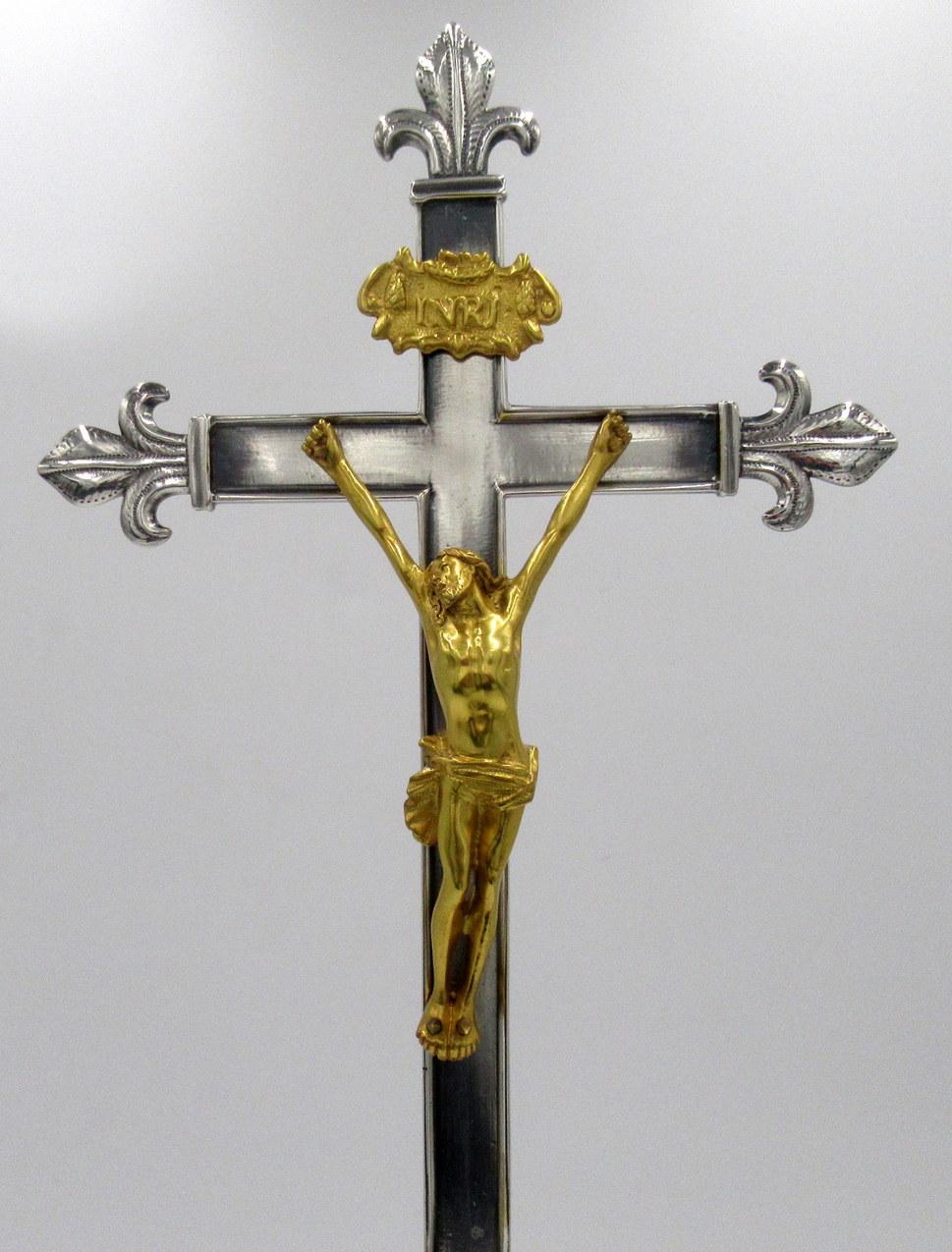 An exceptionally fine quality example of a well cast gilt bronze figure depicting Jesus Christ nailed to a silver plated standing cross of impressive proportions, supported by a very ornate silverplated dome shaped rectangular stand on four claw