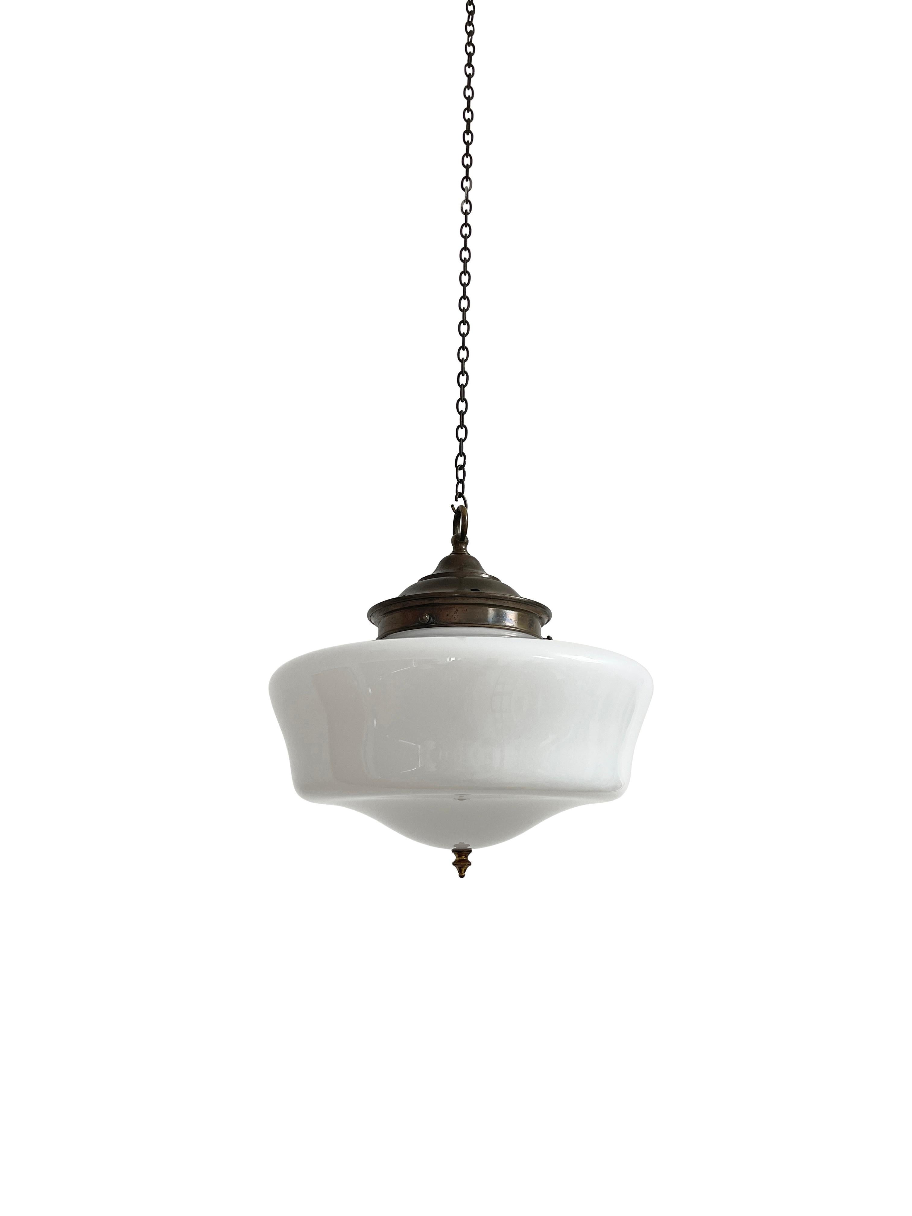 - A beautiful church opaline pendant light, English circa 1930.
- The light has its original gallery and brass finial to the underneath of the shade.
- Wear commensurate with age, all in good condition, there is a very light fissure immediately