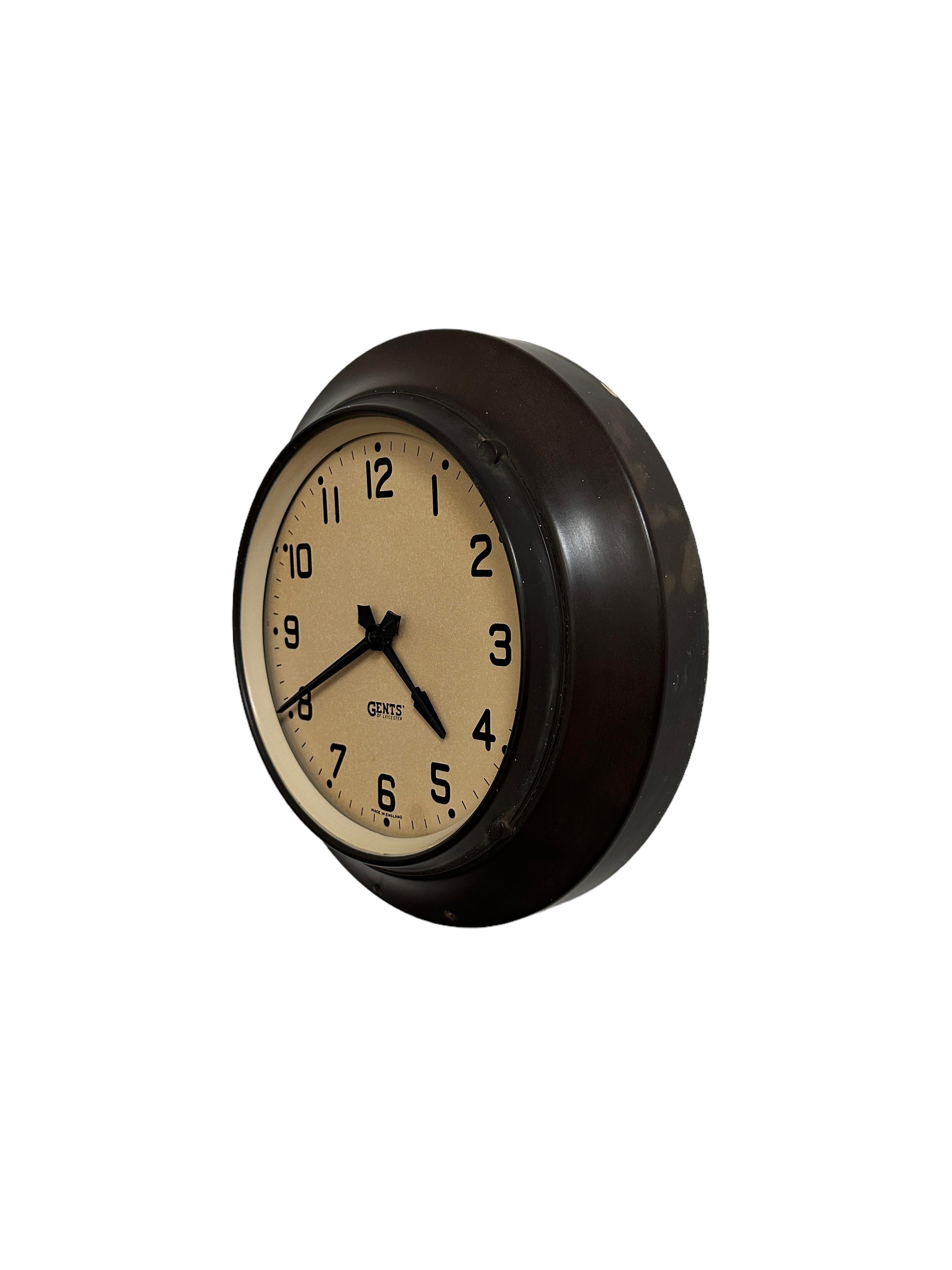- A wonderful Gents' of Leicester factory wall clock, English circa 1940. 
- Beautifully presented, original glass and hands across the face.
- A rich dark brown bakelite casing which is of a rare and unusual design, seldom seen. 
- The clock has